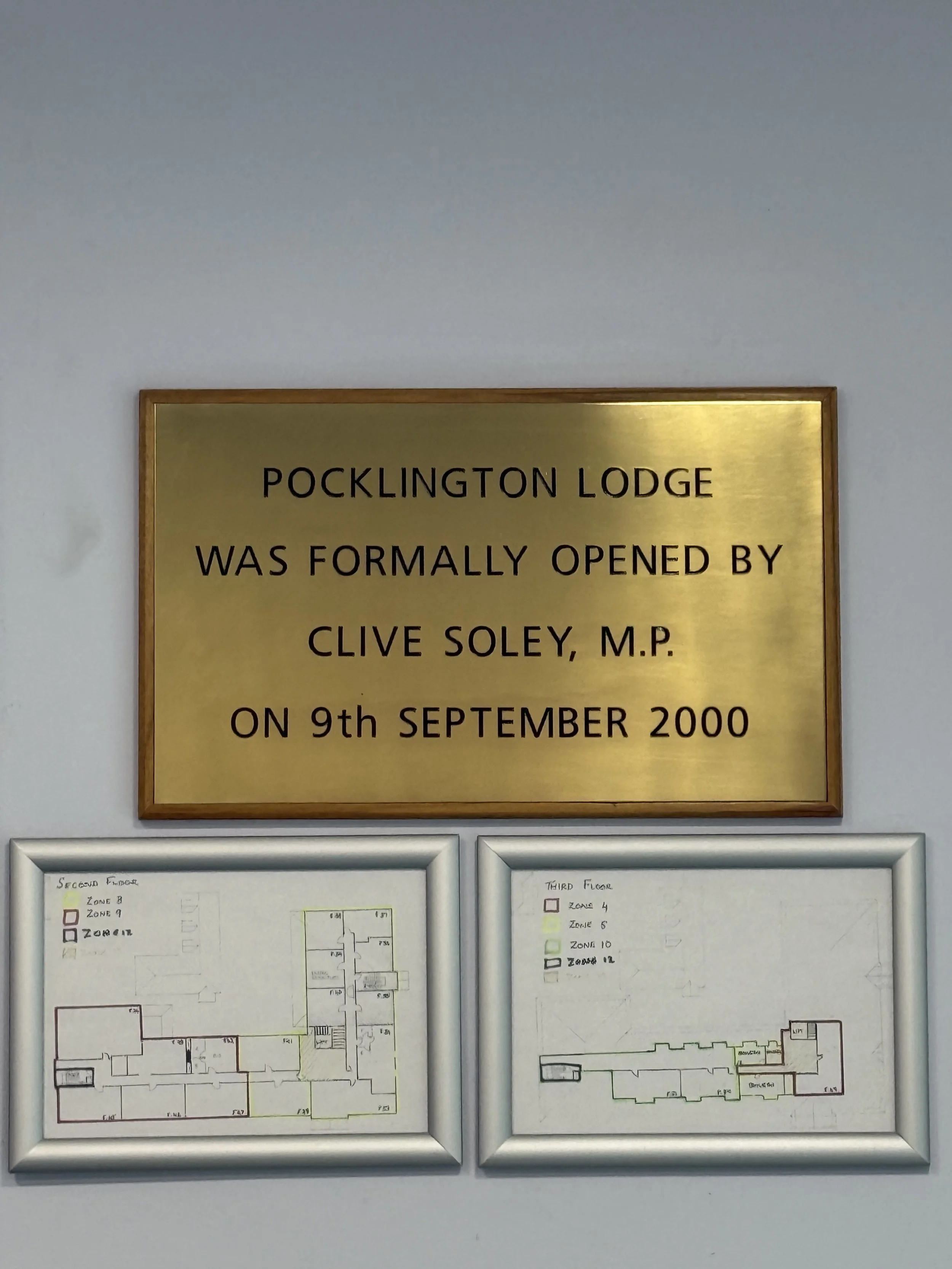 A brass plaque reading "Pocklington Lodge was formally opened by Clive Soley, MP on 9th September 2000"