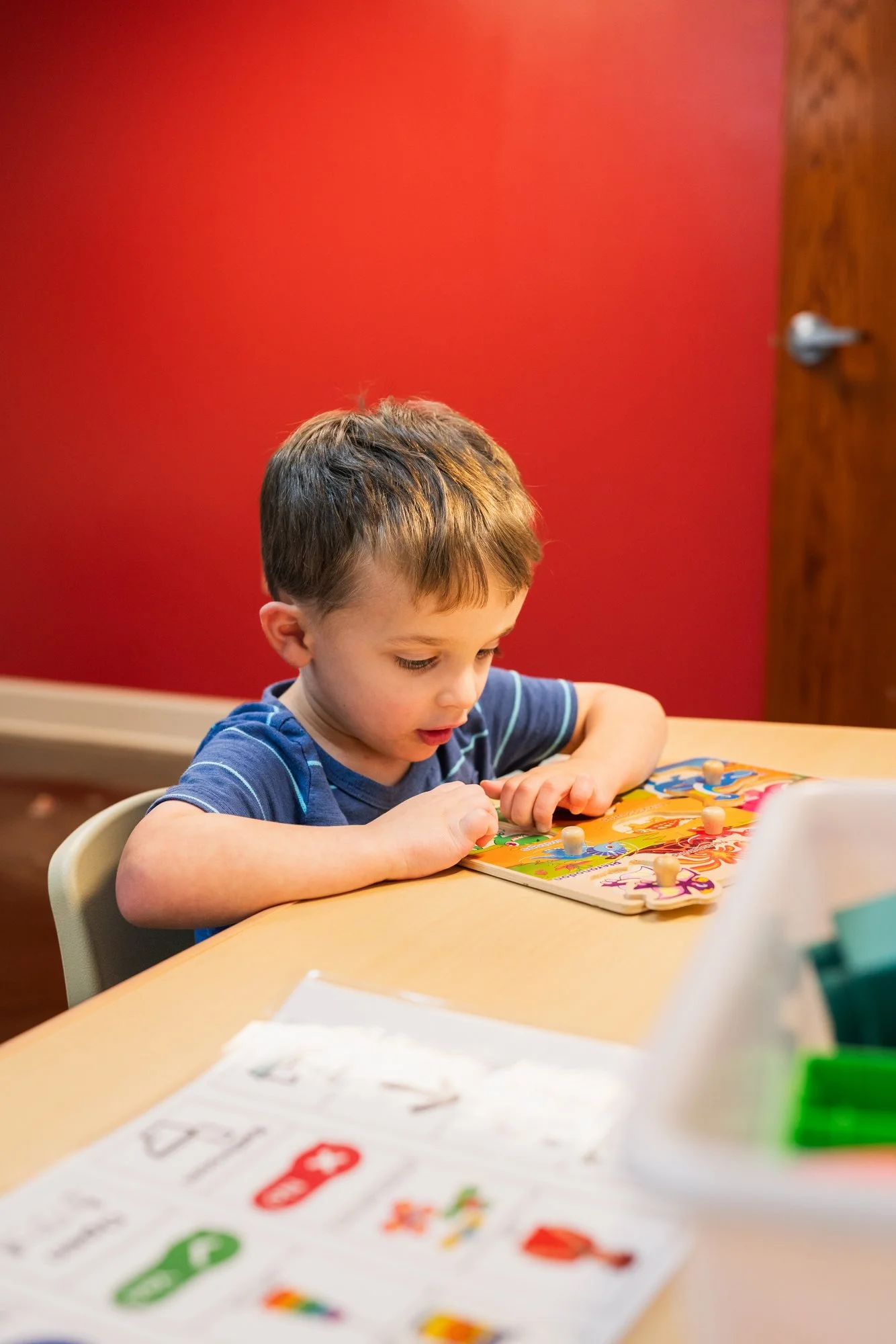 Child working on a puzzle during an ABA therapy session at StarBright Centers