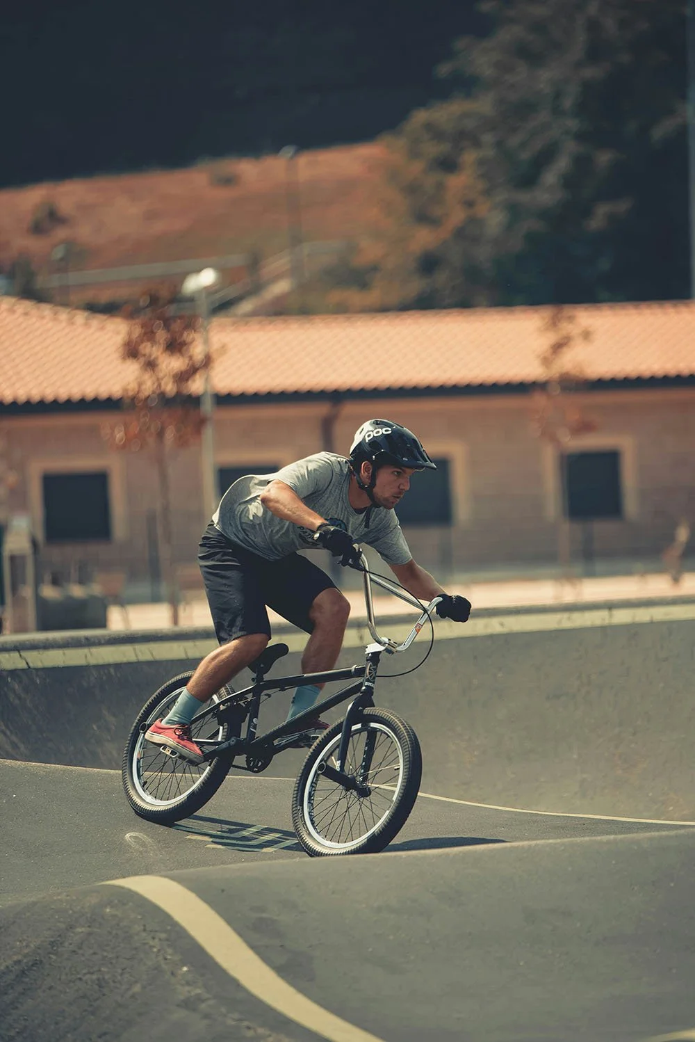 Man on a bike riding on a road.