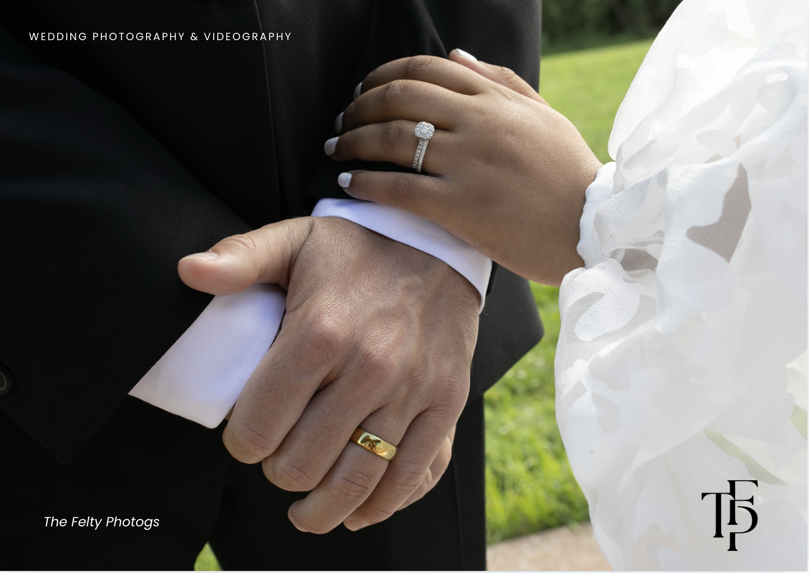 Close-up of a bride and groom holding hands during a wedding, showing wedding rings, with a green outdoor background.