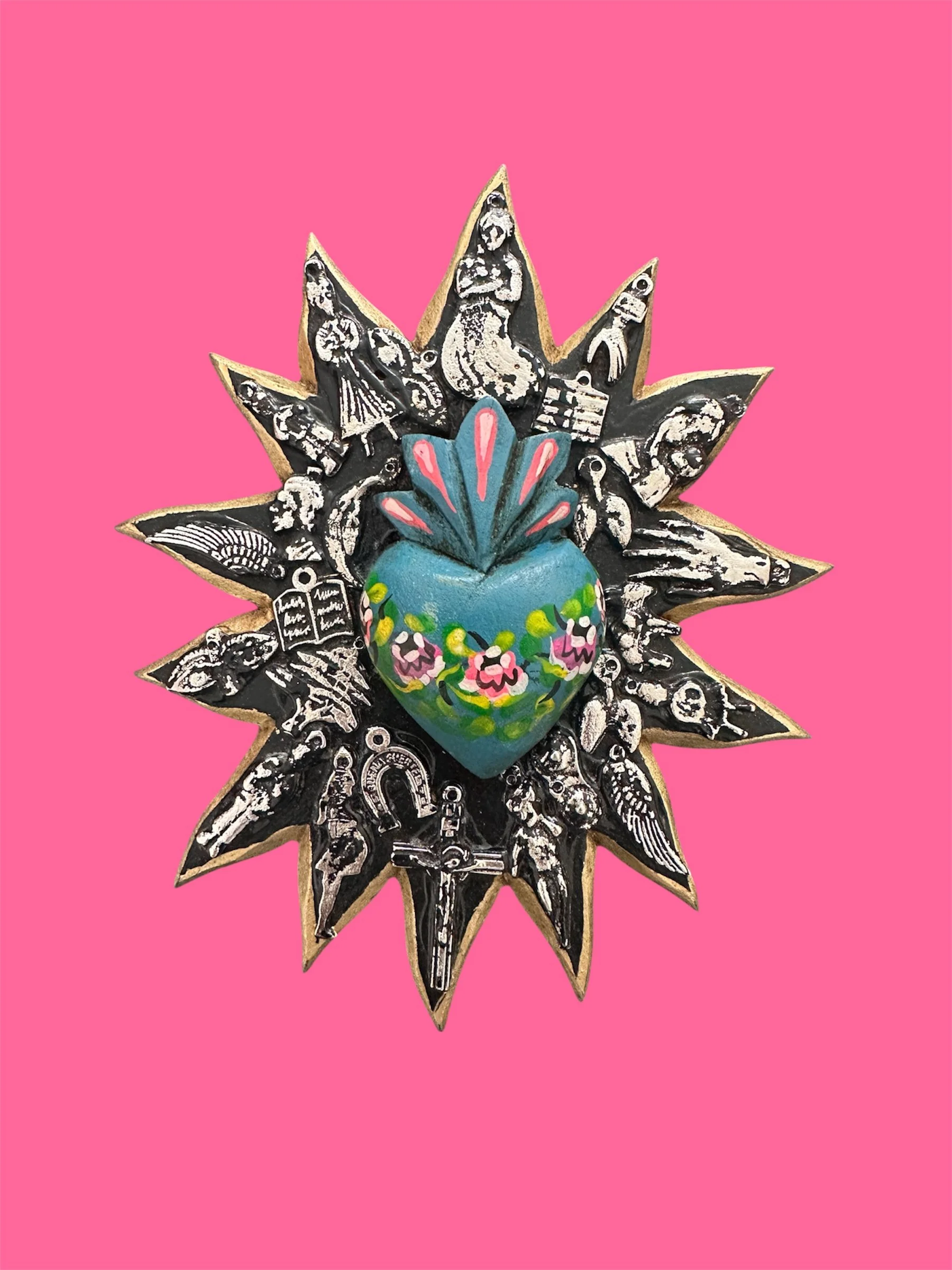 Blue sunburst decorative milagrito ornament handmade in Mexico.