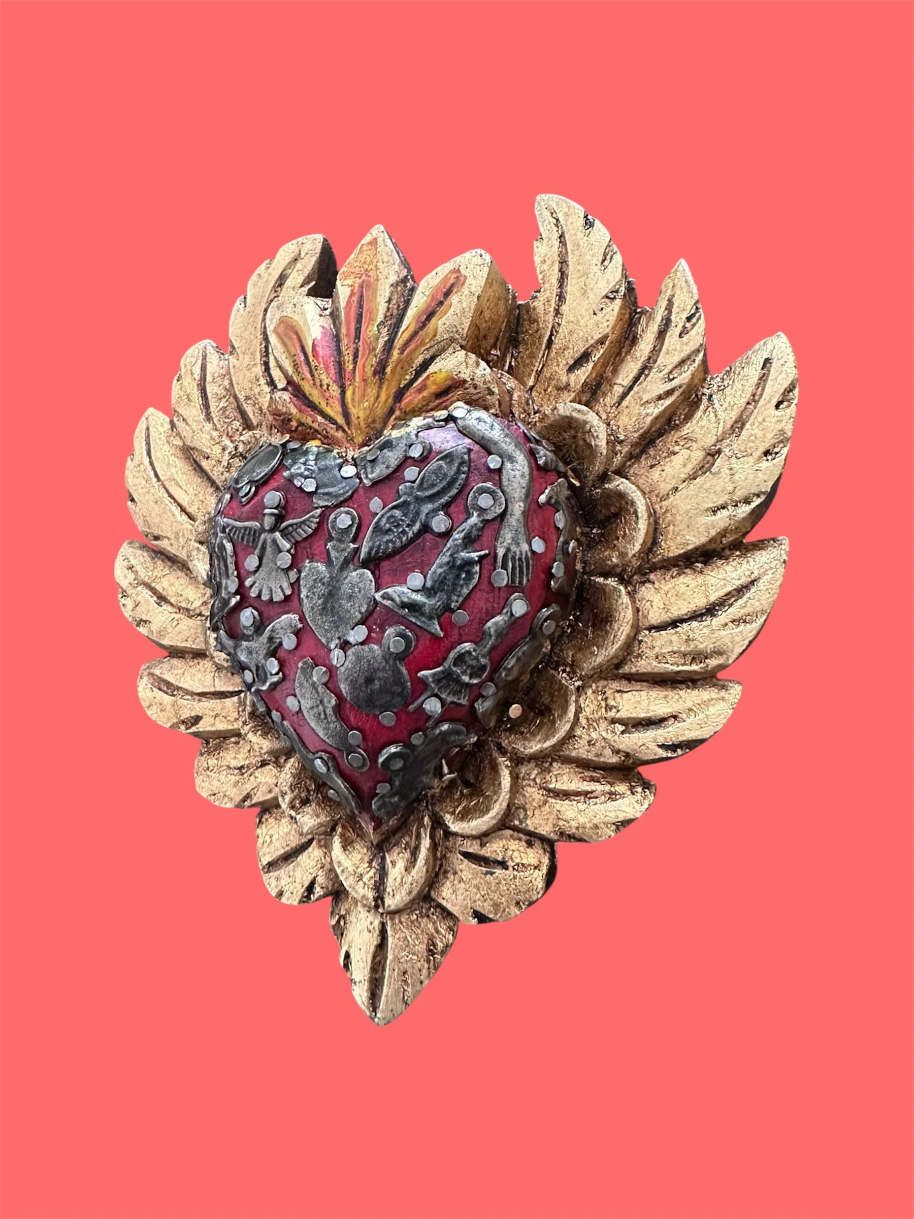 Milagrito heart with wooden wings handcrafted in Mexico.