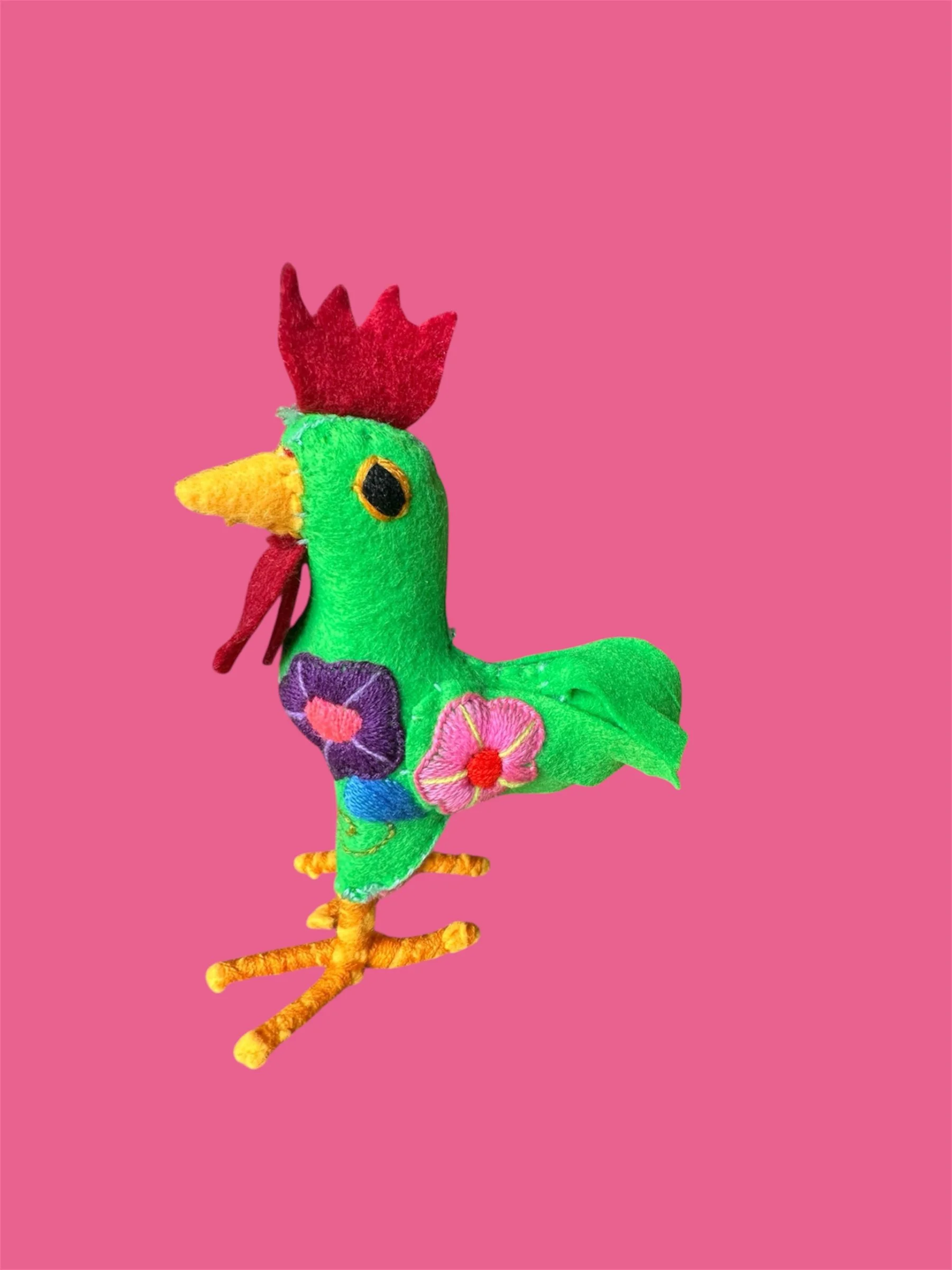 Side view of handmade cockerel soft toy made in Mexico.