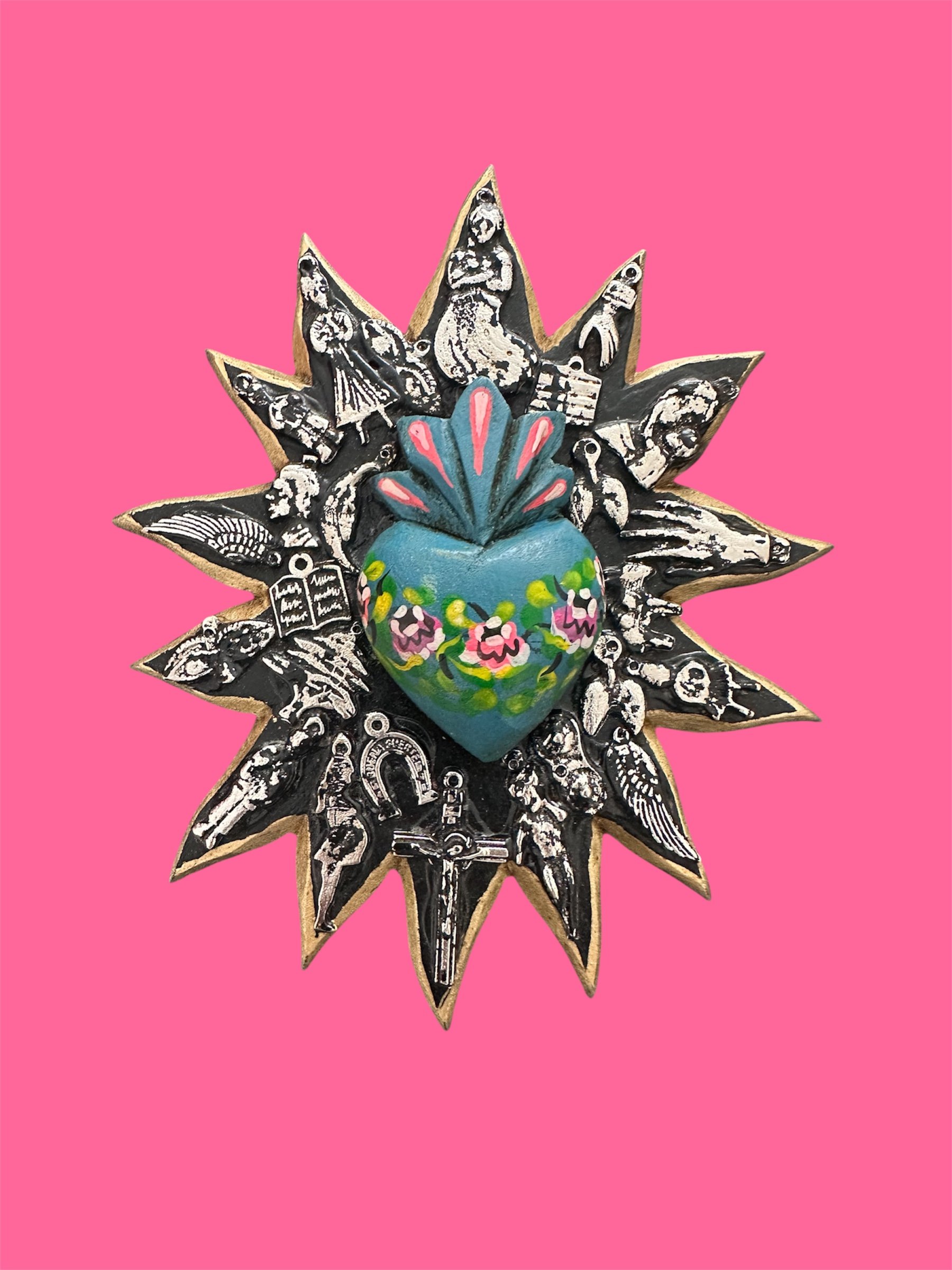 Blue sunburst Mexican milagrito handcrafted in Mexico.