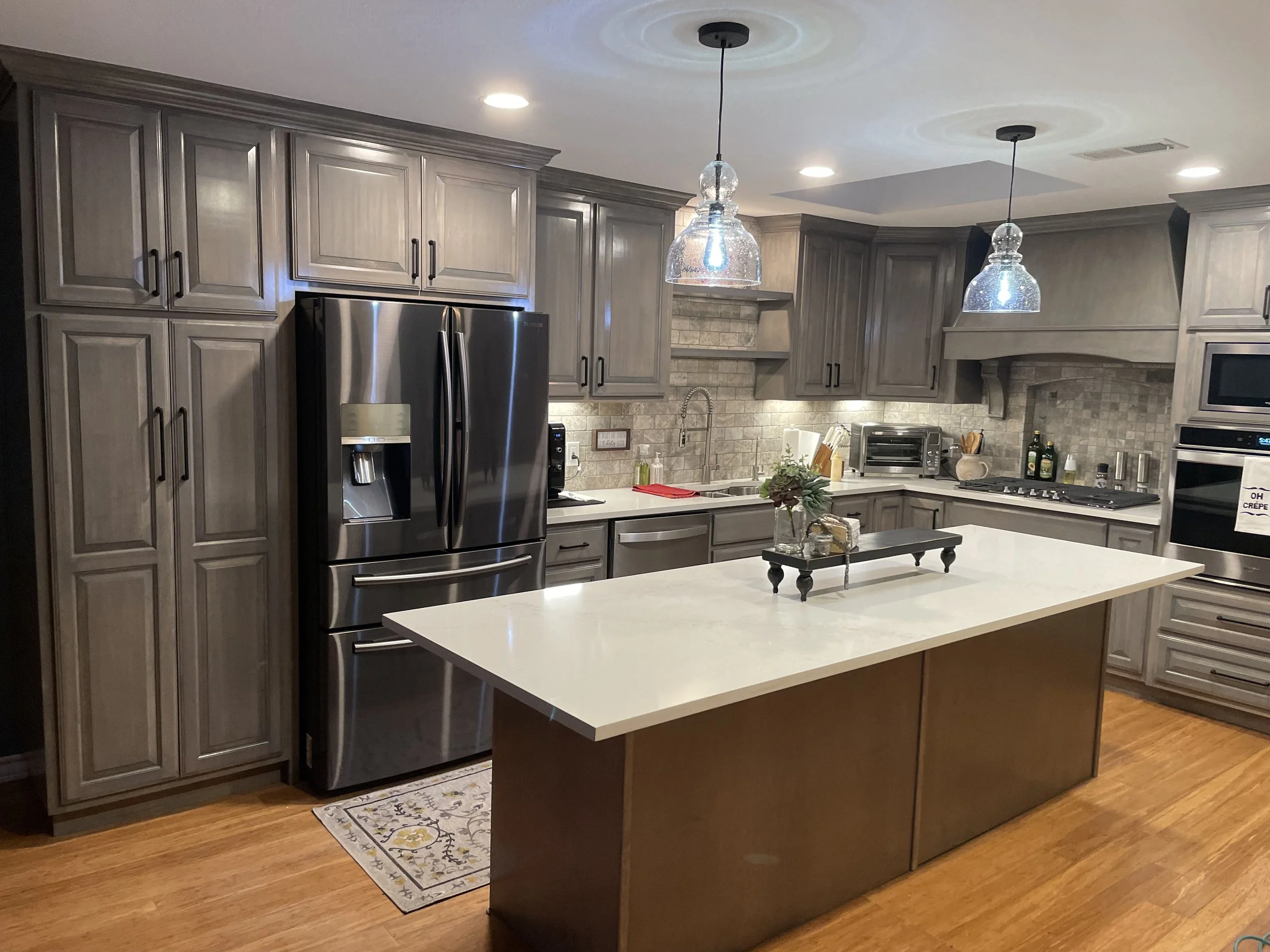 Updated plan adds prep space, new lighting, and efficient storage around the island