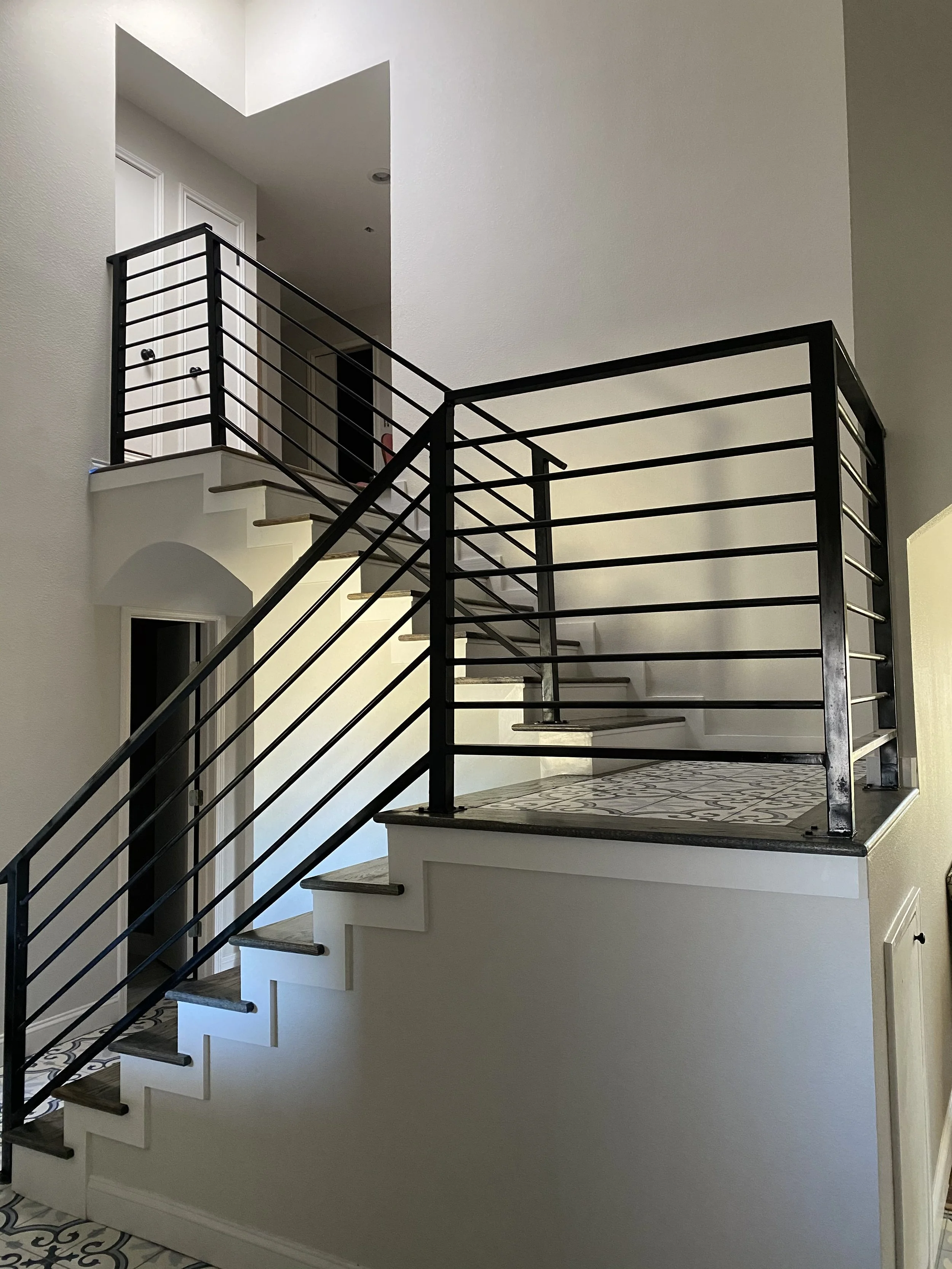 Sleek guardrail updates the stair with clean lines.