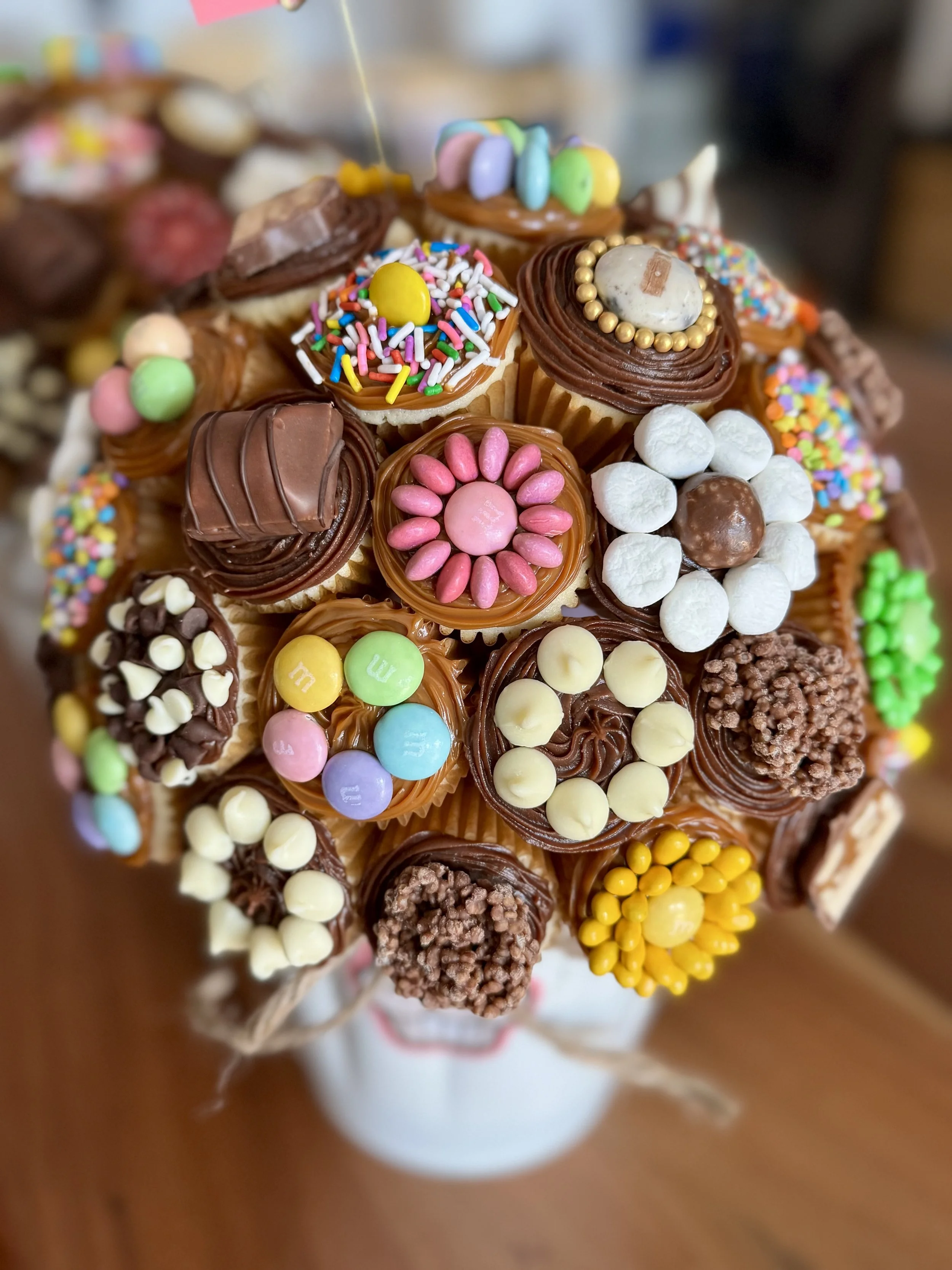 Birthday cupcake bouquet with chocolate and dulce de leche  frosting, m&m's and sprinkles