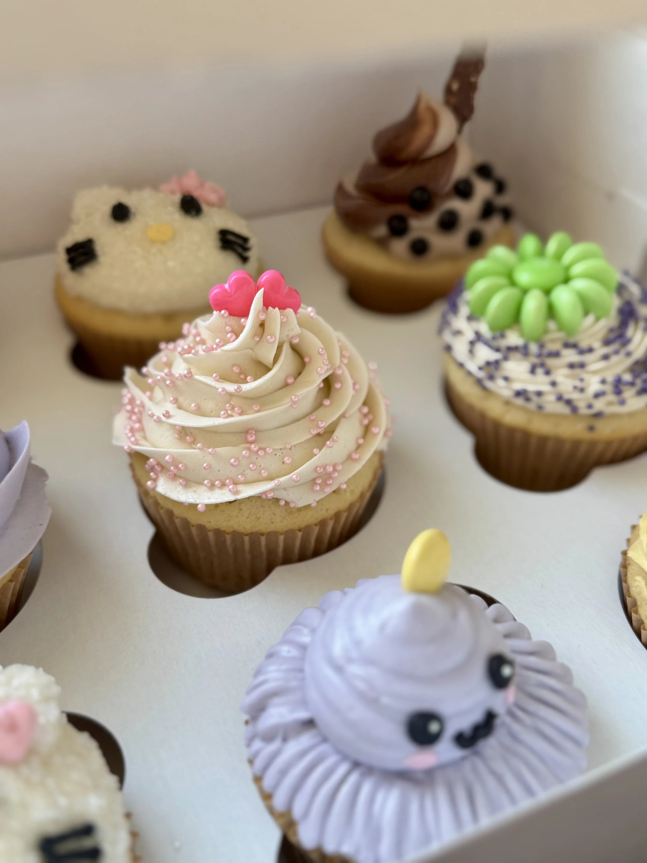 12 cupcake box featuring adorable kawaii style designs and playful details