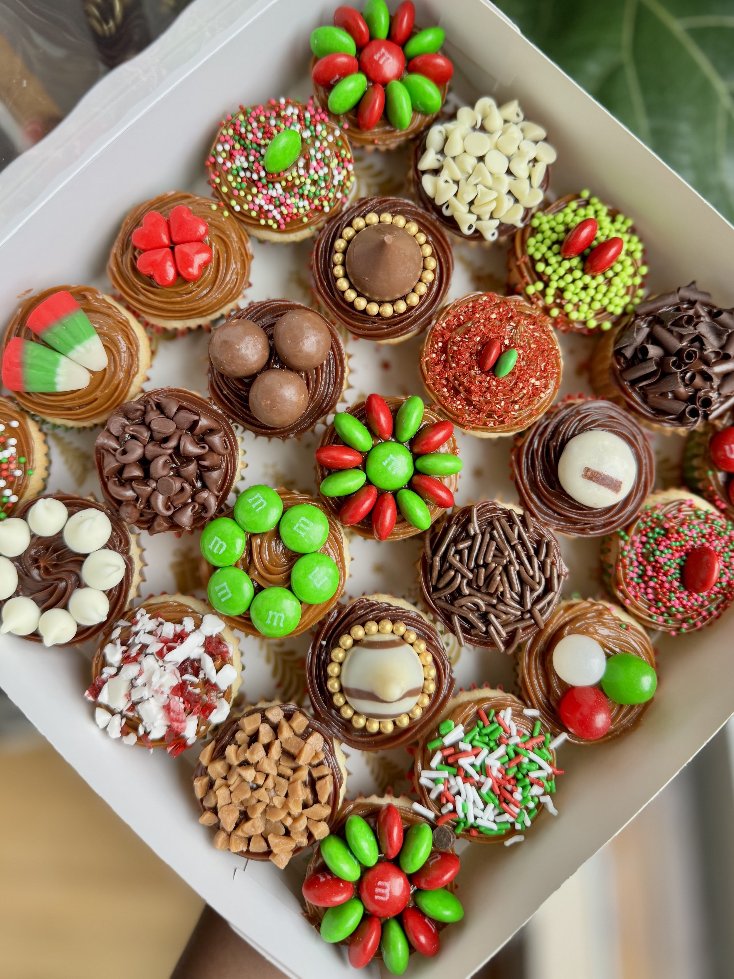 Assorted christmas mini cupcakes in a box