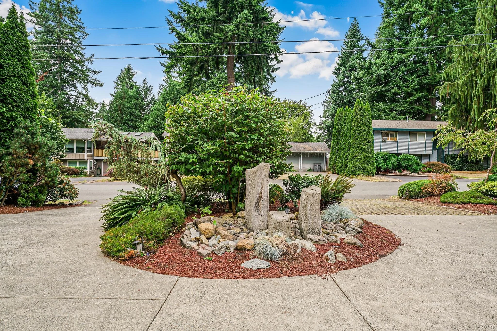Welcoming entrance with landscaped greenery and a circular driveway that provides easy access for families and caregivers.