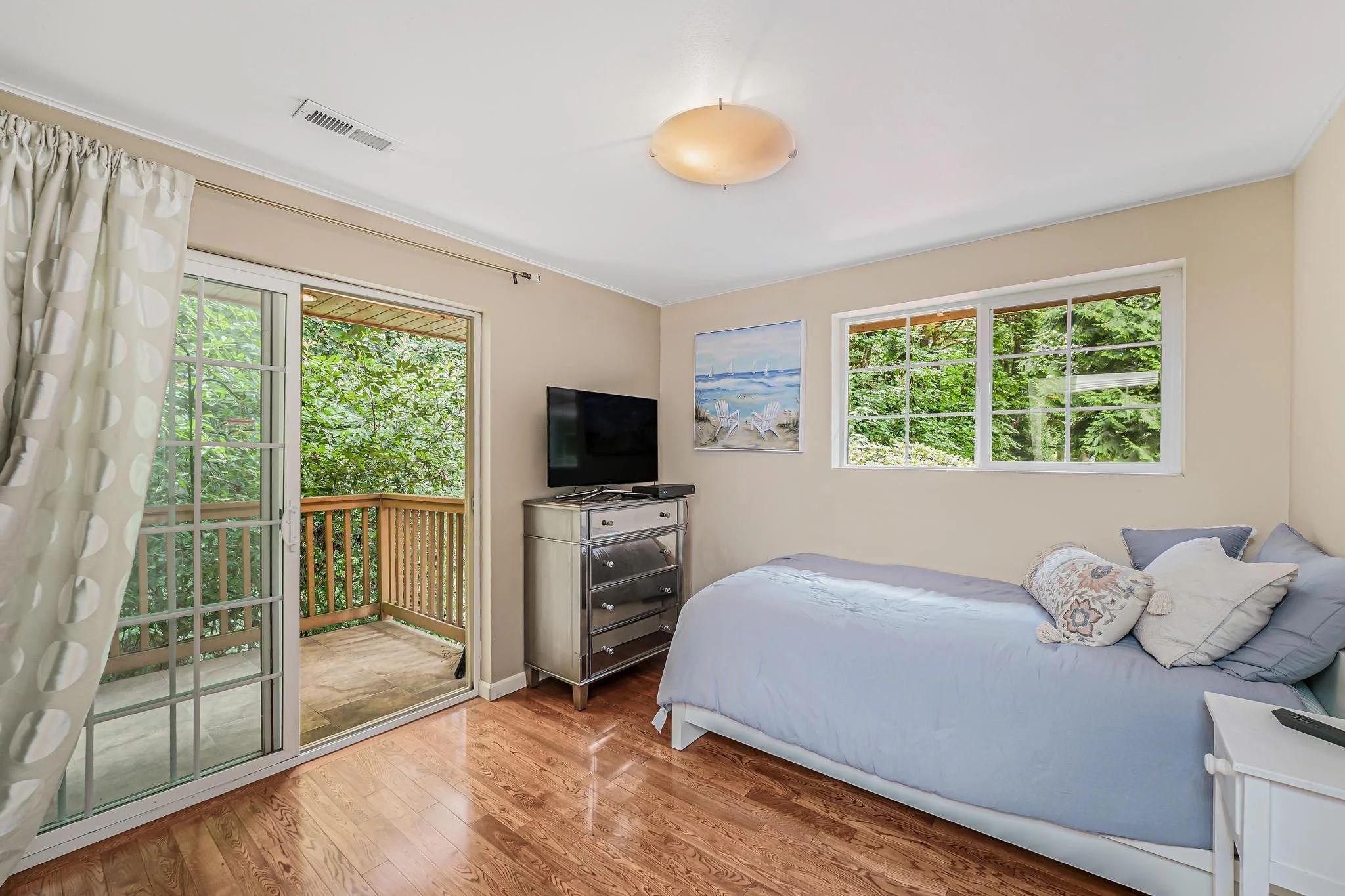 Private bedroom with sliding door to balcony, allowing natural light and a calming connection to the outdoors.