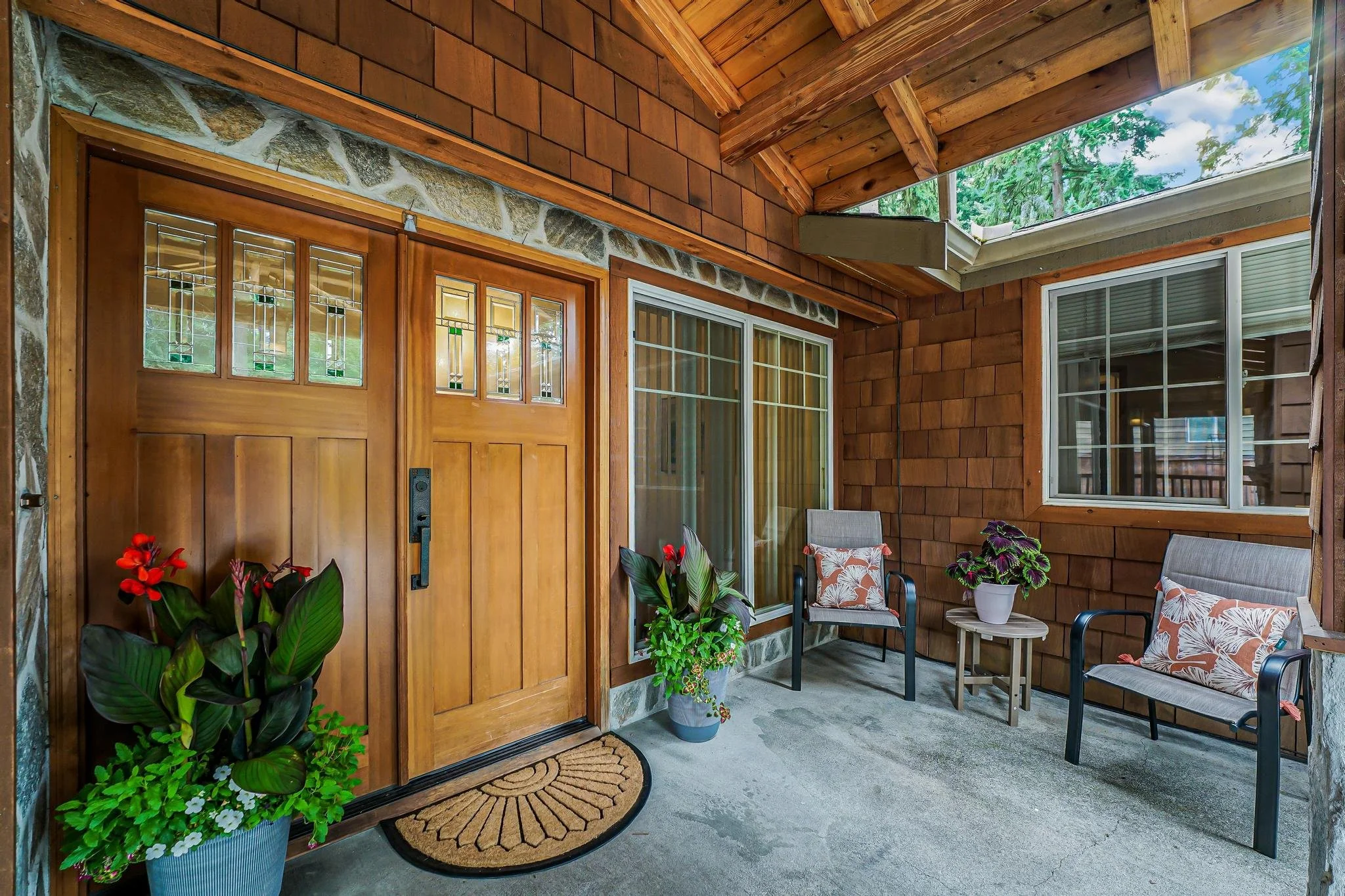 Shaded patio space with flowers and greenery—ideal for peaceful conversations or quiet moments outside.