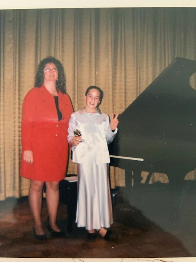 Tracy Lovley with a student at a piano recital