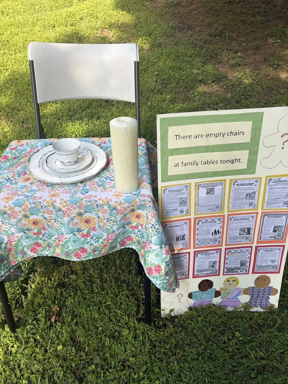 A display representing the empty chairs at family tables.