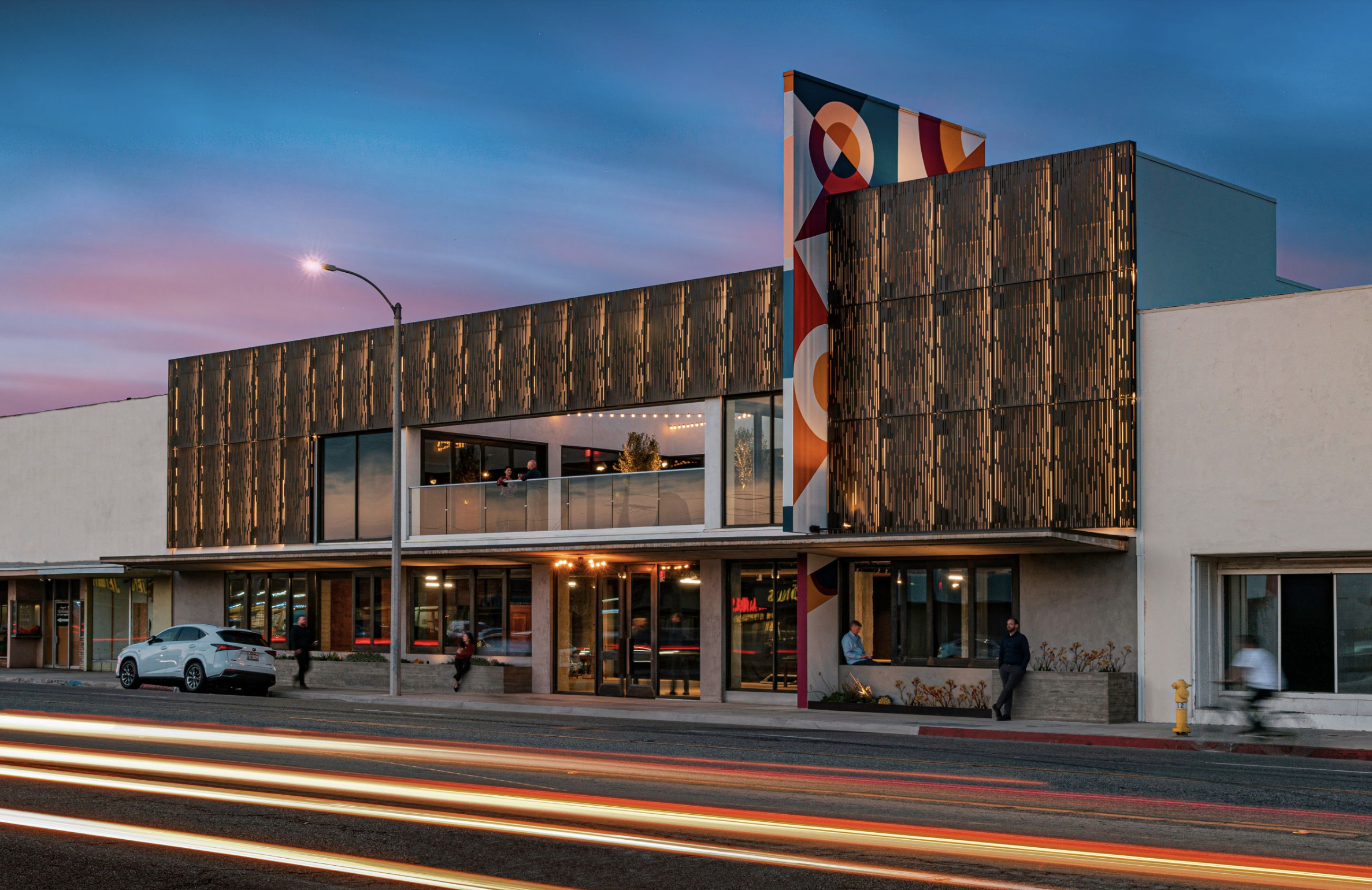 Exterior office building mural by Pandr Design Co. featuring colorful, geometric shapes.