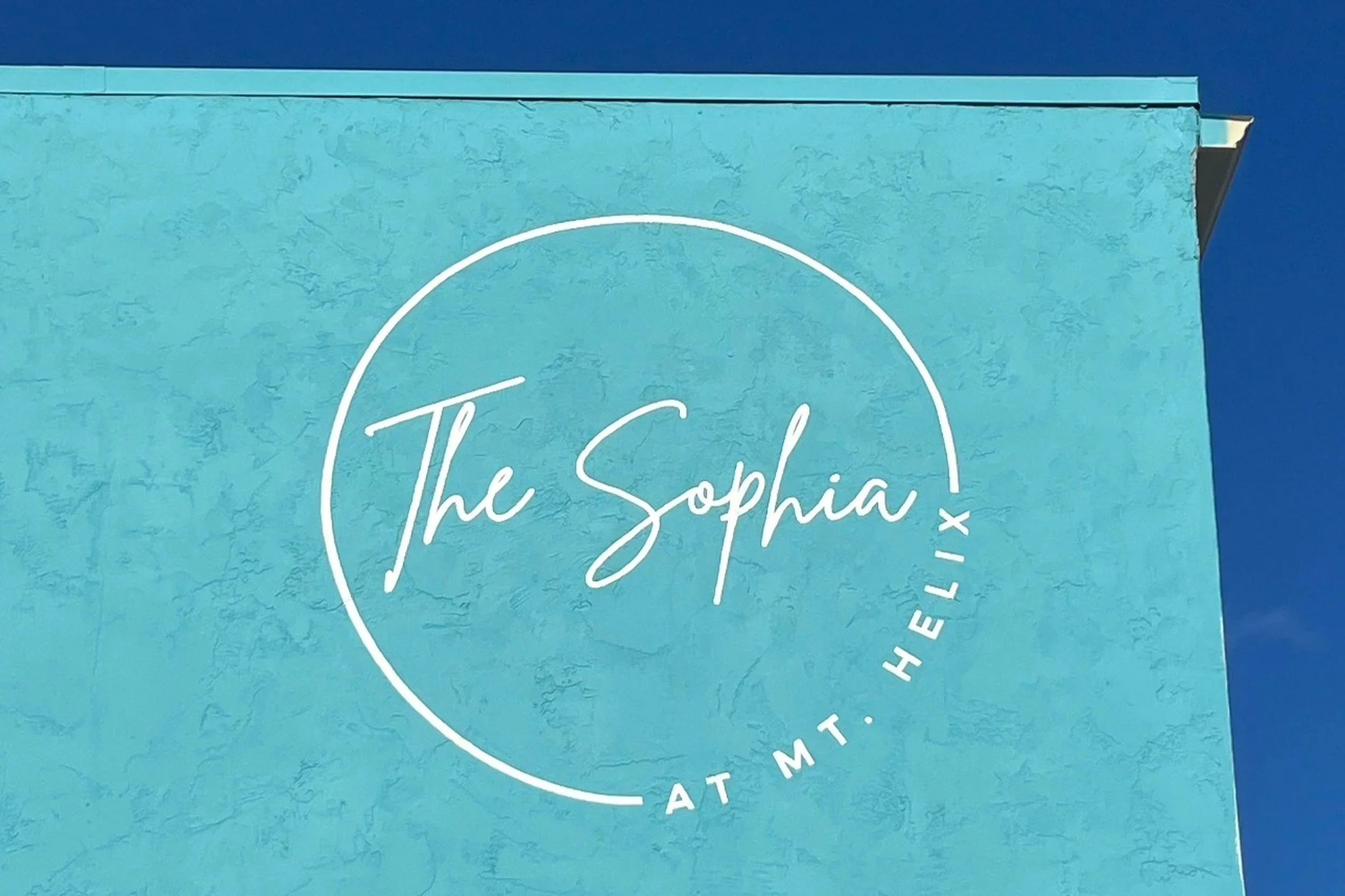 Mt. Helix logo handpainted in white on blue by Pandr Design Co.