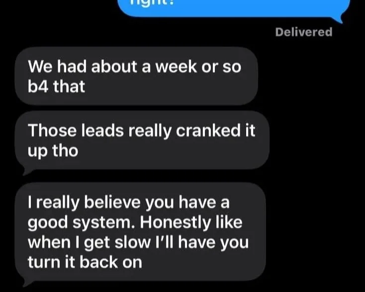 A screenshot of a text message conversation with black bubbles containing white text, discussing technical issues and system performance.