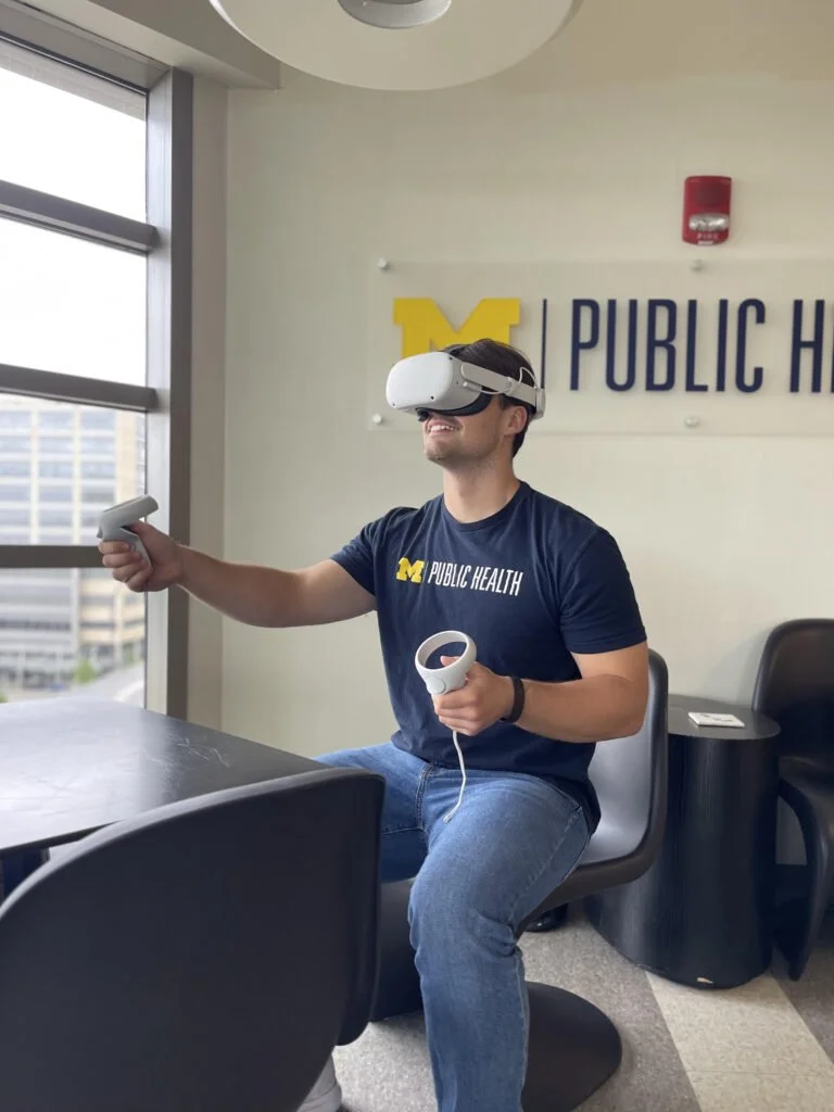 A researcher wearing a Virtual Reality Headset.