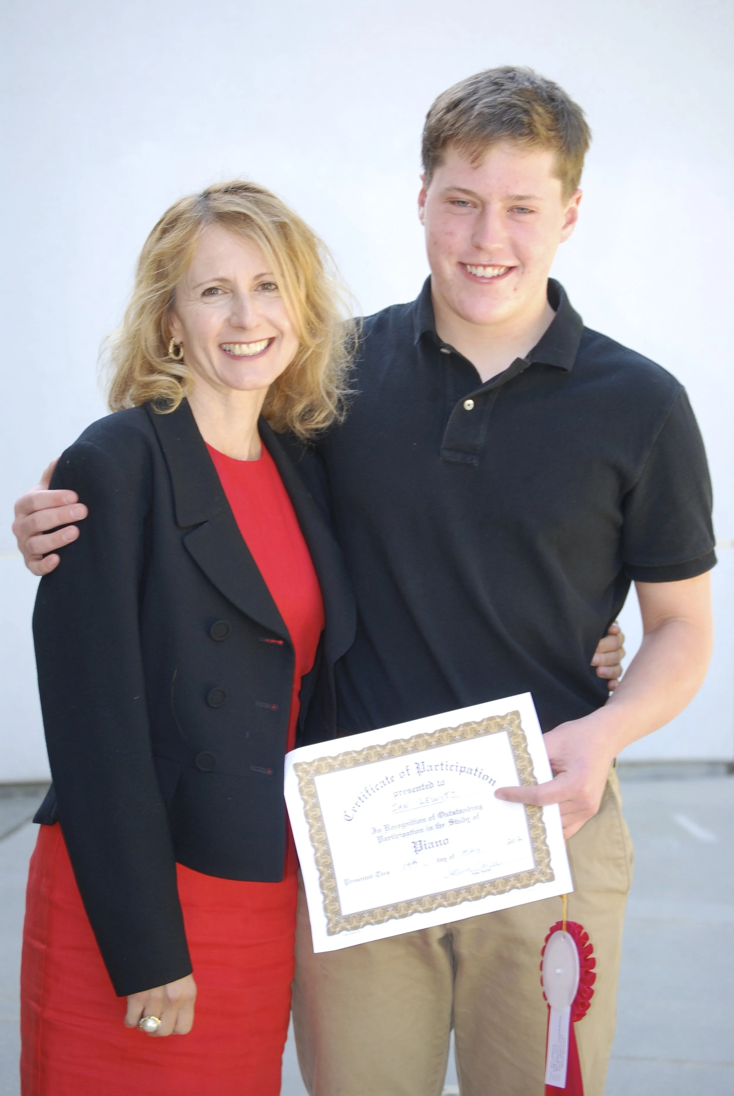 Cristina Marcu and Student with a Certificate of Merit for music excellence