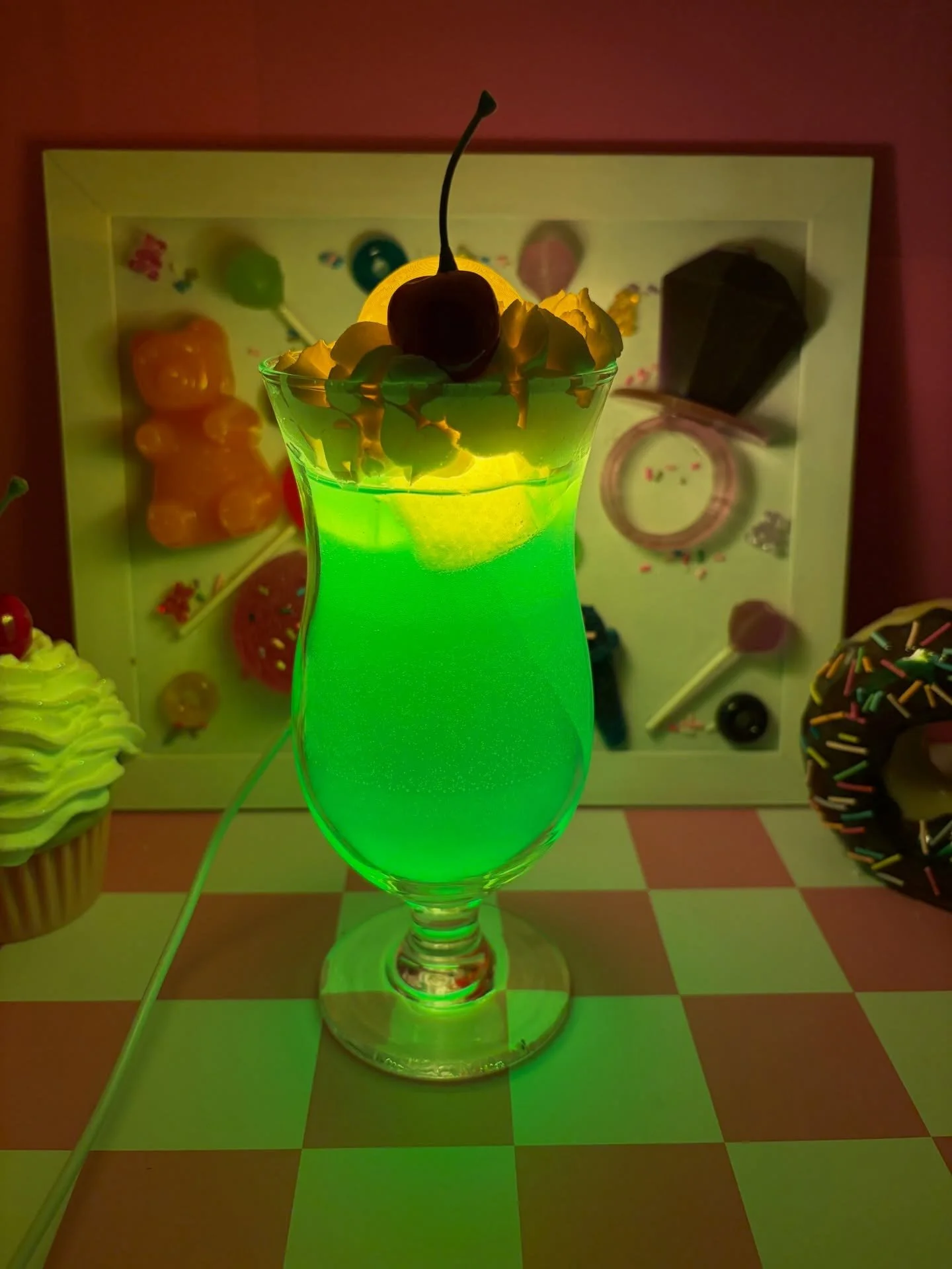 A project I&rsquo;ve been working on for a while! 

It looks like a delicious melon soda float, but it&rsquo;s actually a lamp.

I used a real hurricane glass, then poured layers of matching resin to create the melons soda. I 3D printed the ice cubes