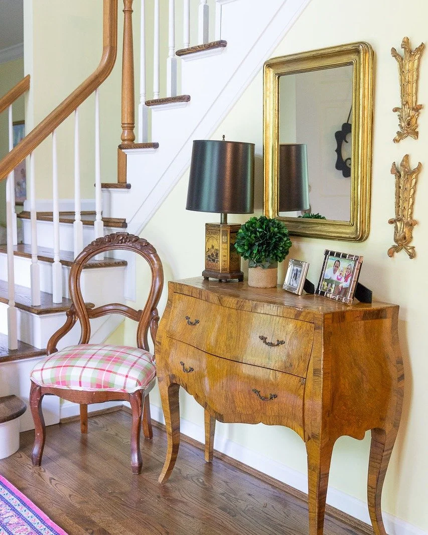 A timeless welcome: rich wood tones, gilded accents, and a touch of playful pattern set the stage for a foyer that feels both elegant and inviting.

Photography: @kwdcreative 

#windinglaneinteriors #interiordesign #midwestliving #cincinnatiinteriord