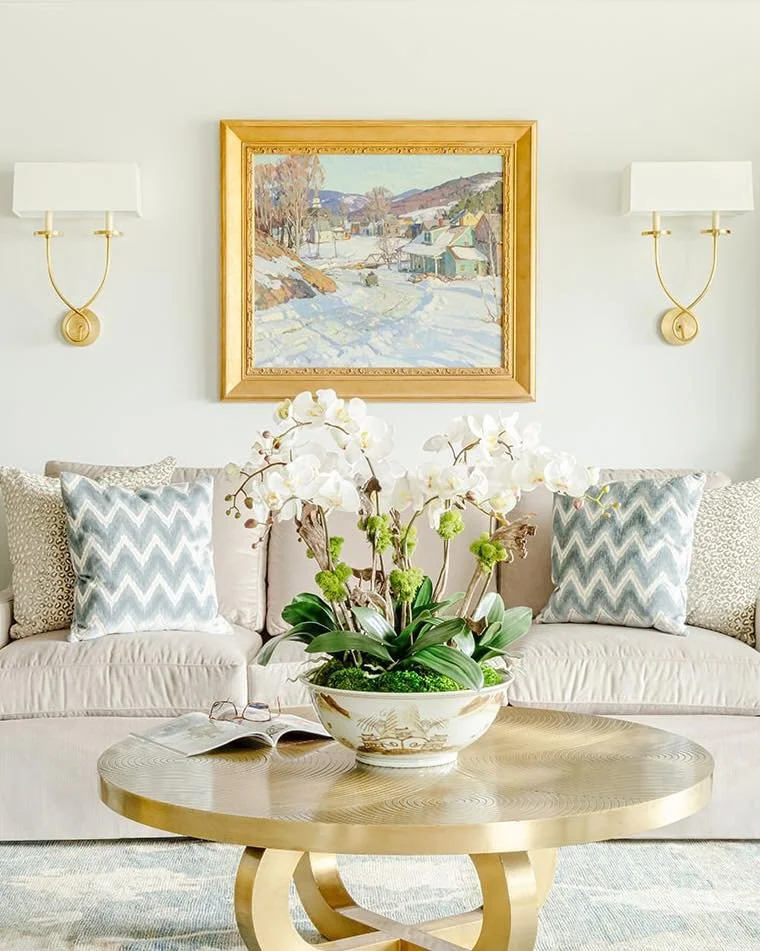 An heirloom painting of a snowy day sparked the vision for this living room &mdash; a space designed to feel elegant yet inviting, perfect for gathering with friends, playing the piano, and watching the snow drift over the city and the Ohio River.

T