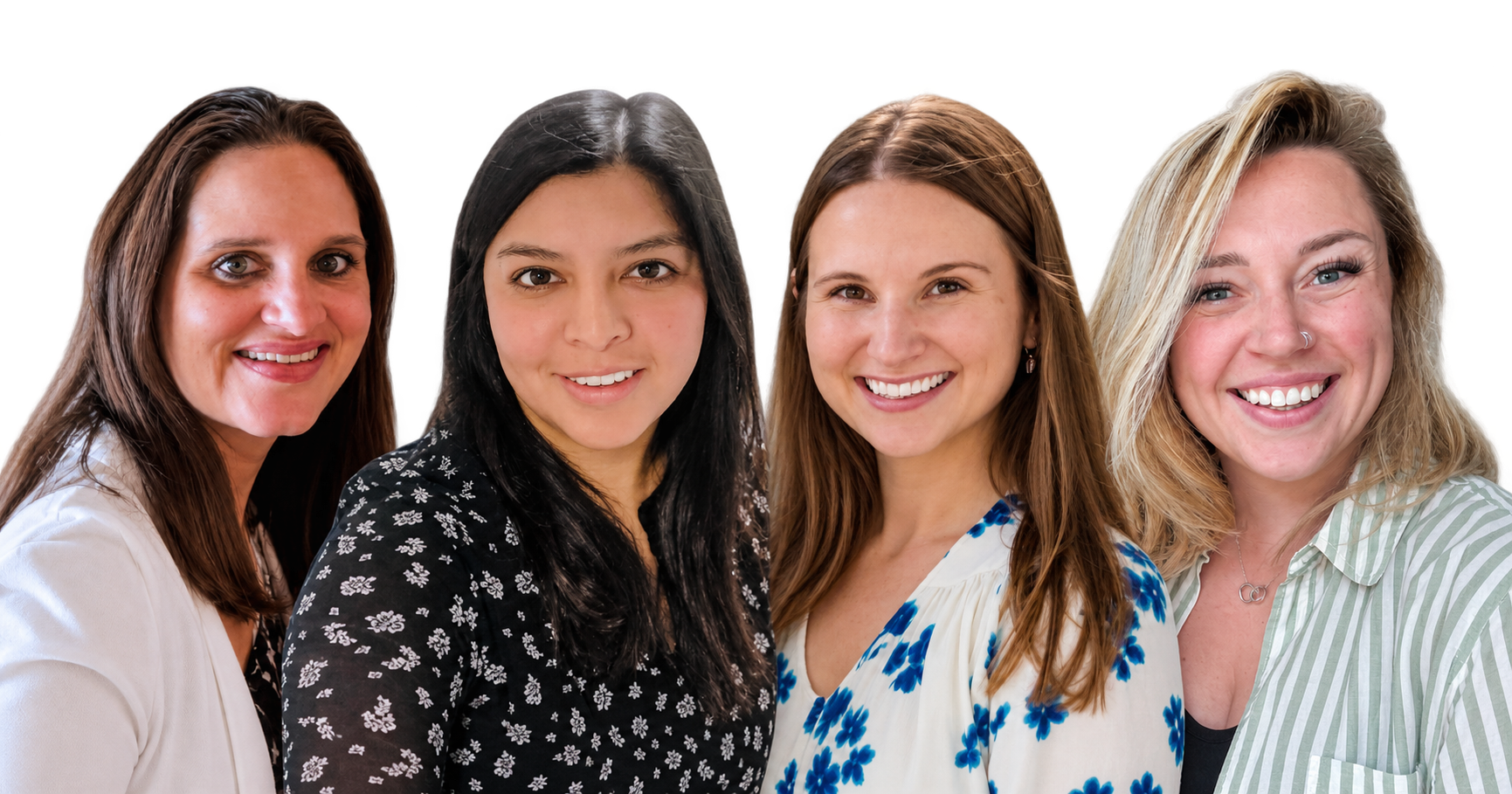 Group of four smiling women posing together, three with brown hair, one with blonde hair, wearing casual clothing.