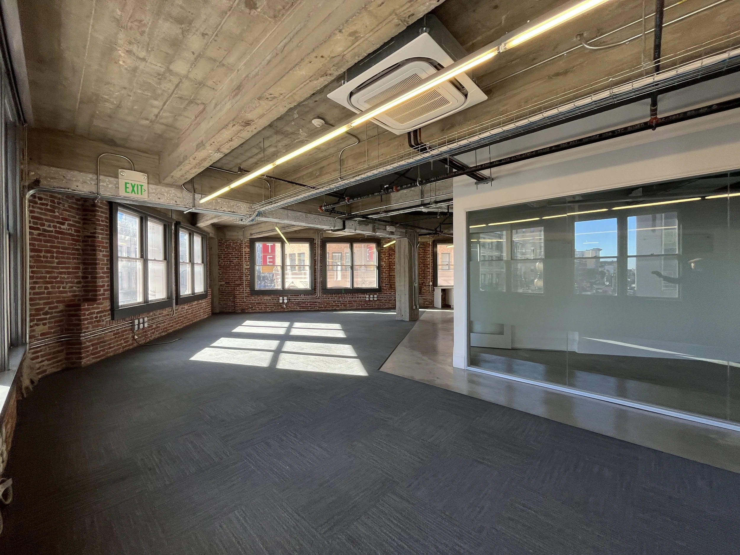  Warfield Commons 3rd floor open space with brick. 