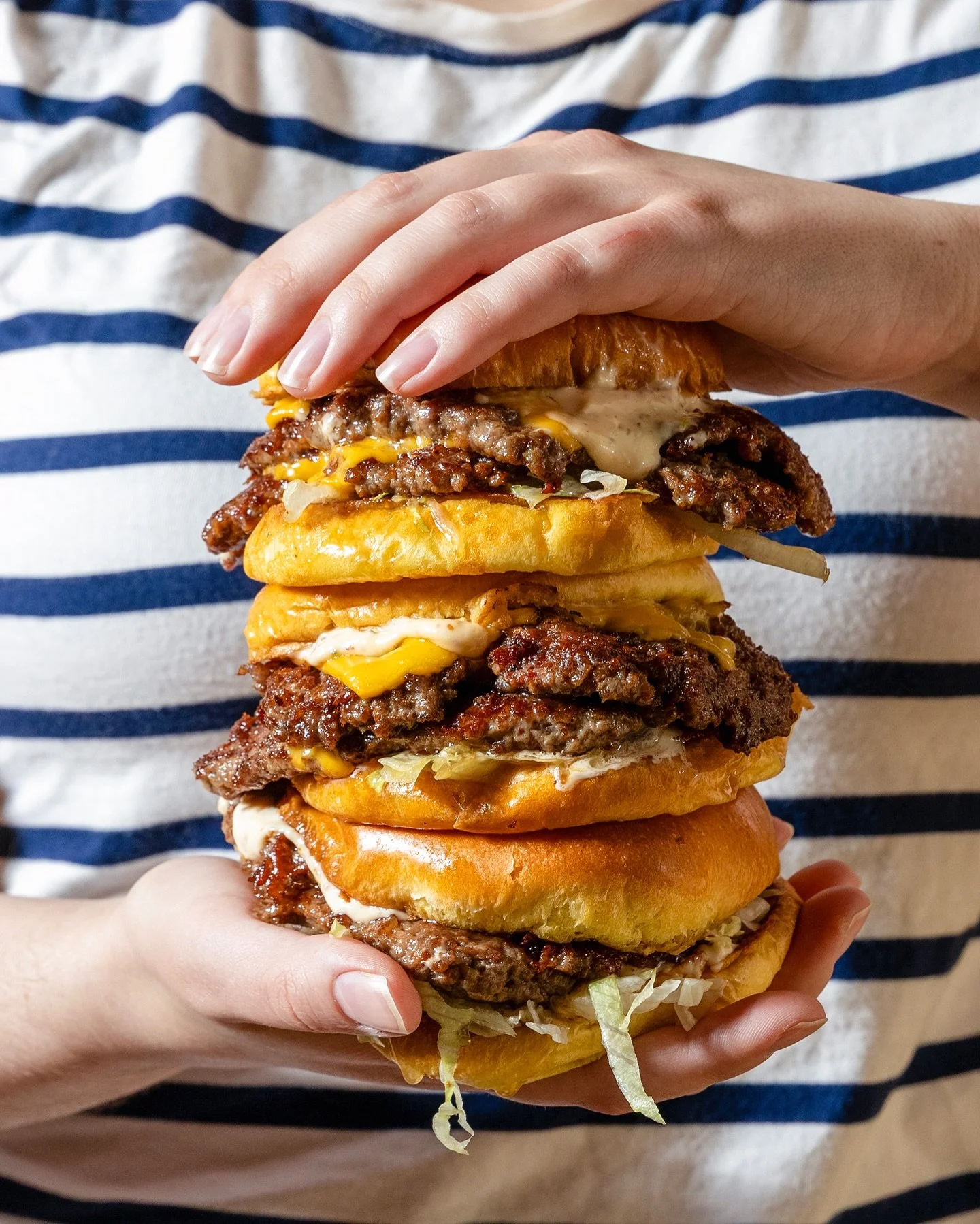 Sunday plans: let&rsquo;s smash 🍔

Ground beef and ground bacon patties, pressed crispy on the griddle, stacked on a brioche bun with Kerch sauce, lettuce, and American cheese. How many do you think you could you eat in one sitting?! 

Pull up to Bi