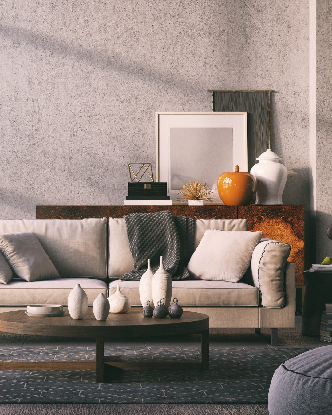 Living room with a beige sofa, decorative pillows, a wooden coffee table with white vases, and a textured backdrop with framed artwork and decorative objects.