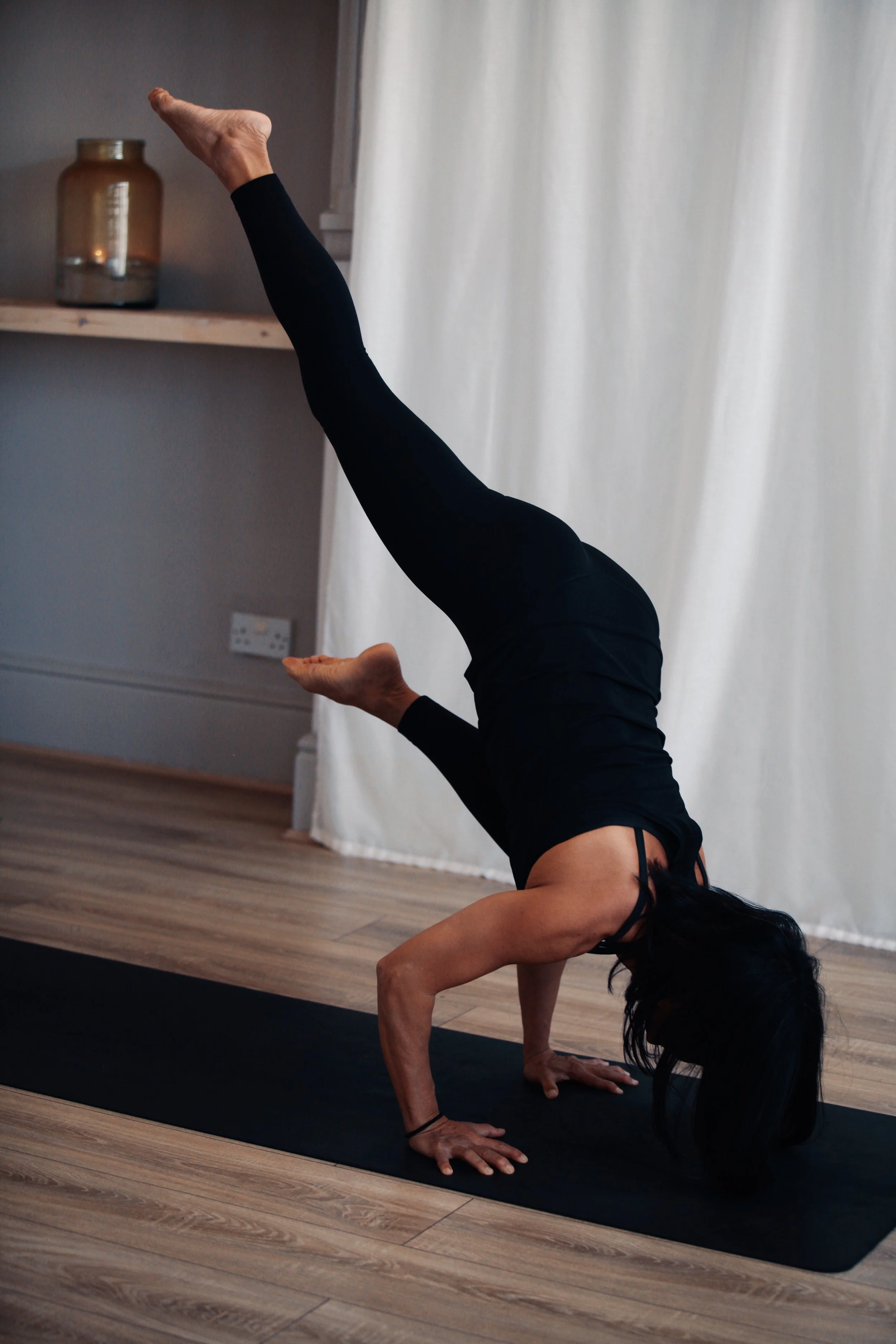 Advanced yoga practitioner demonstrating strength, balance and body awareness during yoga teacher training.