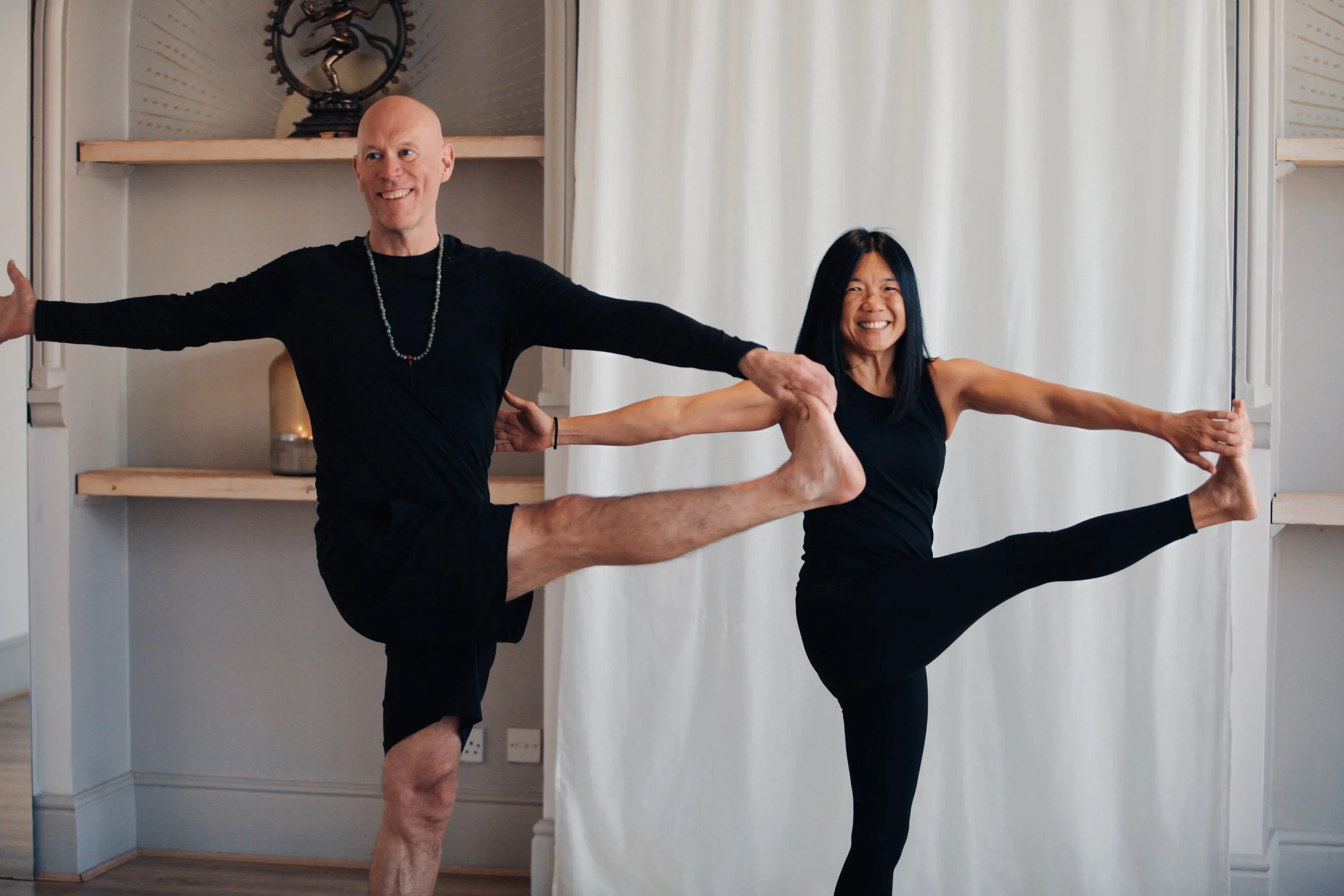 Gregory Angell guiding students through advanced yoga postures during Bhānumatī Yoga teacher training at SoulSpace Academy.
