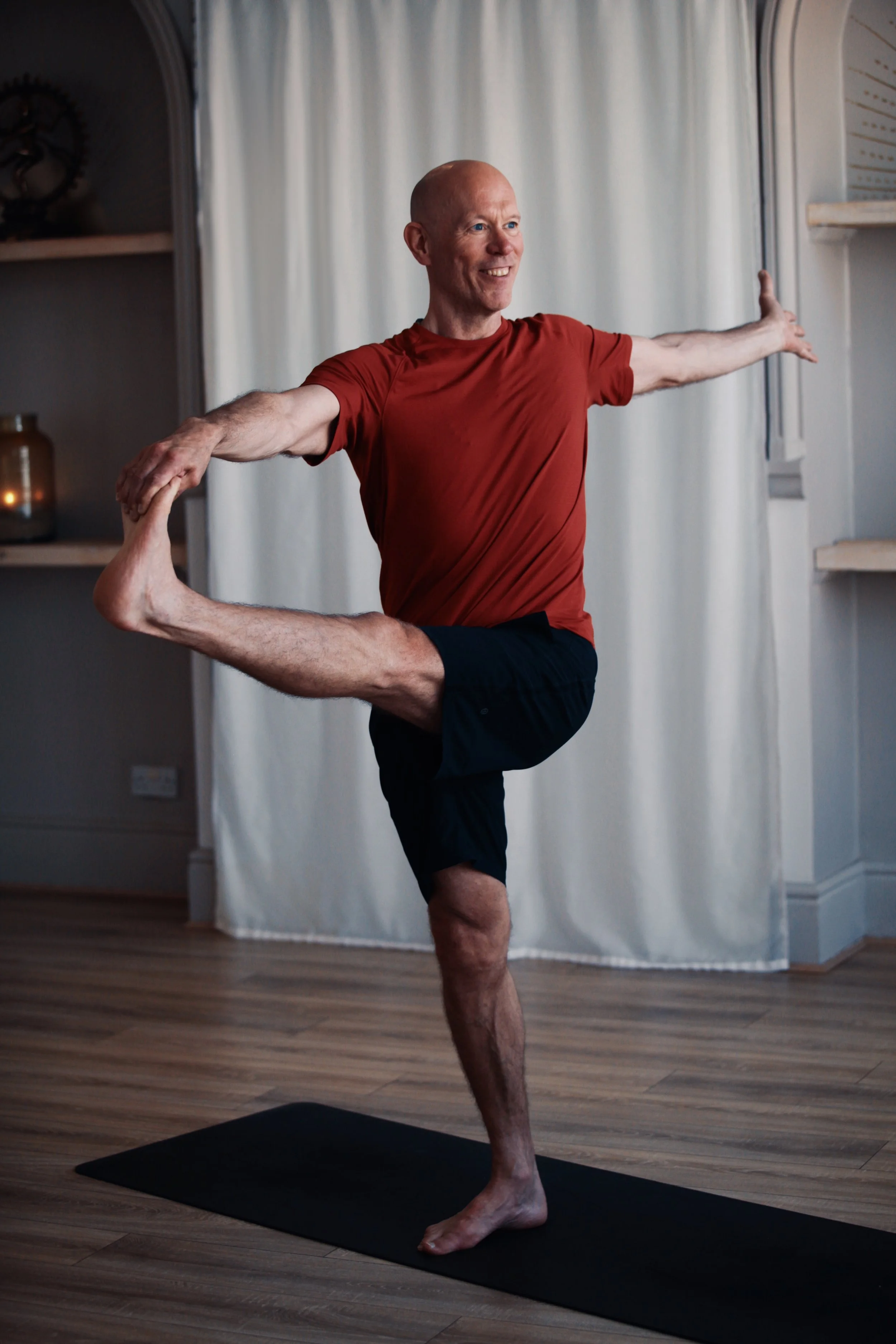 Demonstrating balance, concentration and body awareness as part of advanced yoga teacher training.
