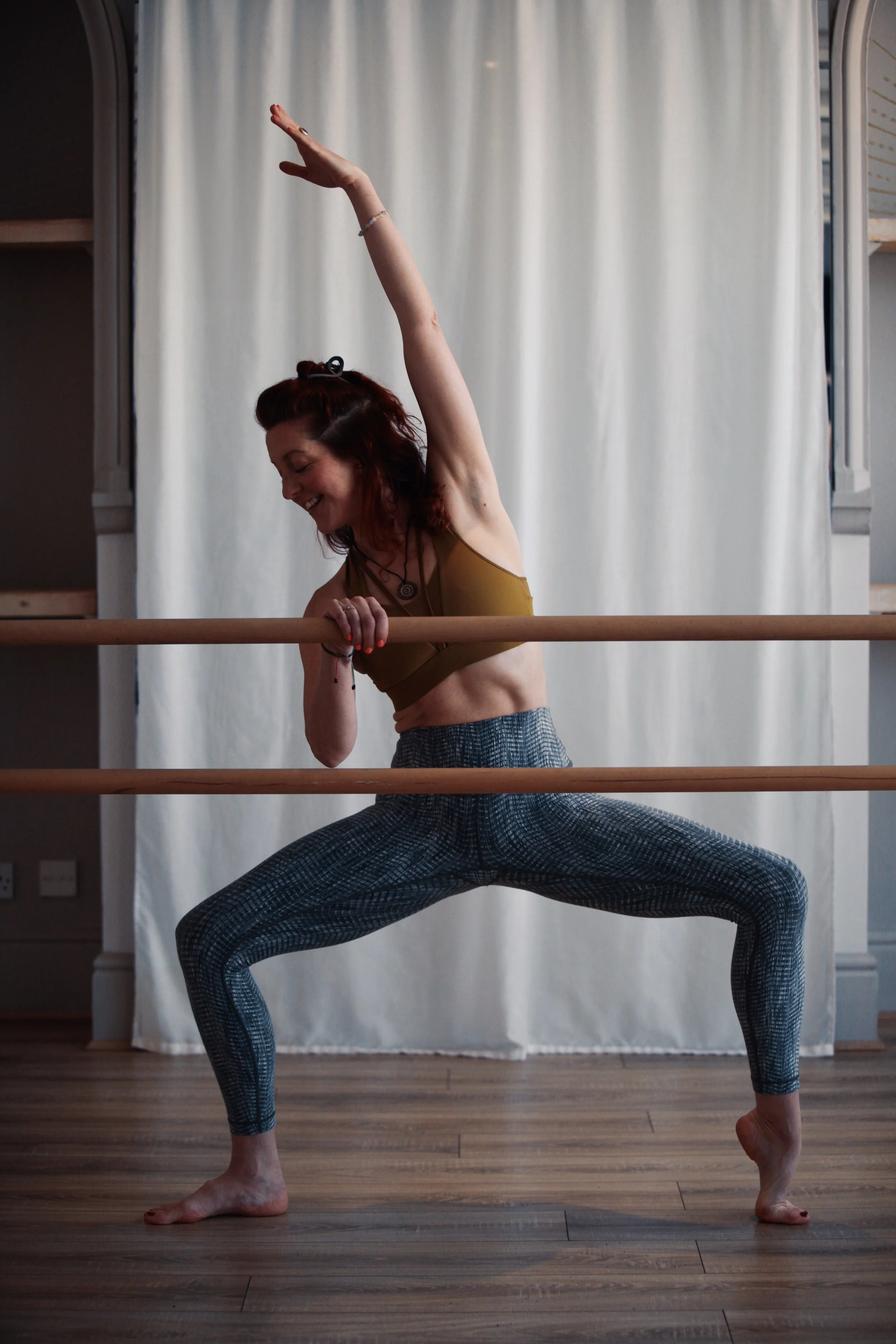 Barre teacher trainee developing strength, balance and technique through practical movement training.
