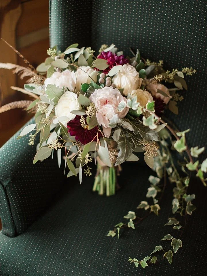 branching out bride bouquet feathers.jpg