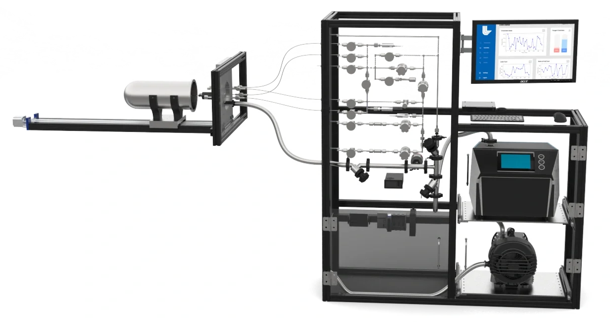 Laboratory setup with a gas flow system, including a metallic chamber, pipes, monitors displaying graphs, and electronic equipment on a metal frame.