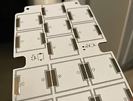 Close-up of multiple white electrical outlets on a wall.