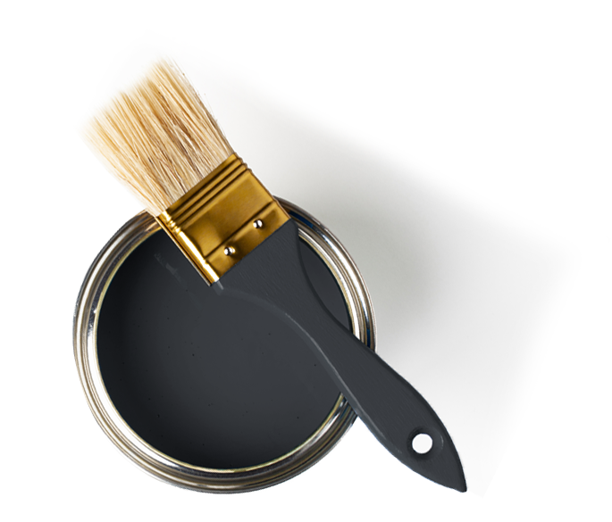A paintbrush with beige bristles resting on the edge of an open can of black paint with a white background.