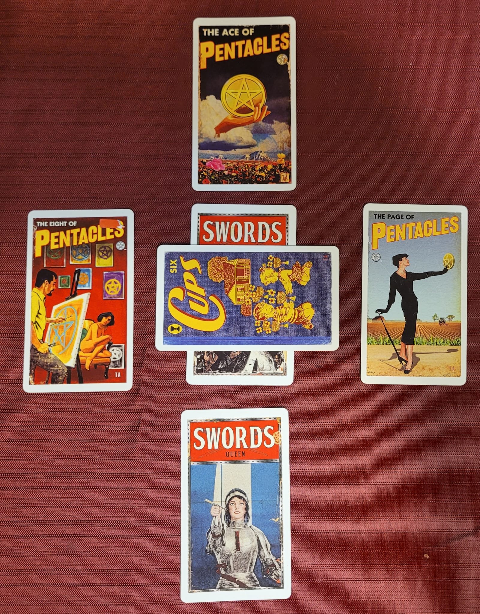 A Celtic cross tarot spread with the cards knight of swords, six of cups, queen of swords, 8 of pentacles, ace of pentacles.