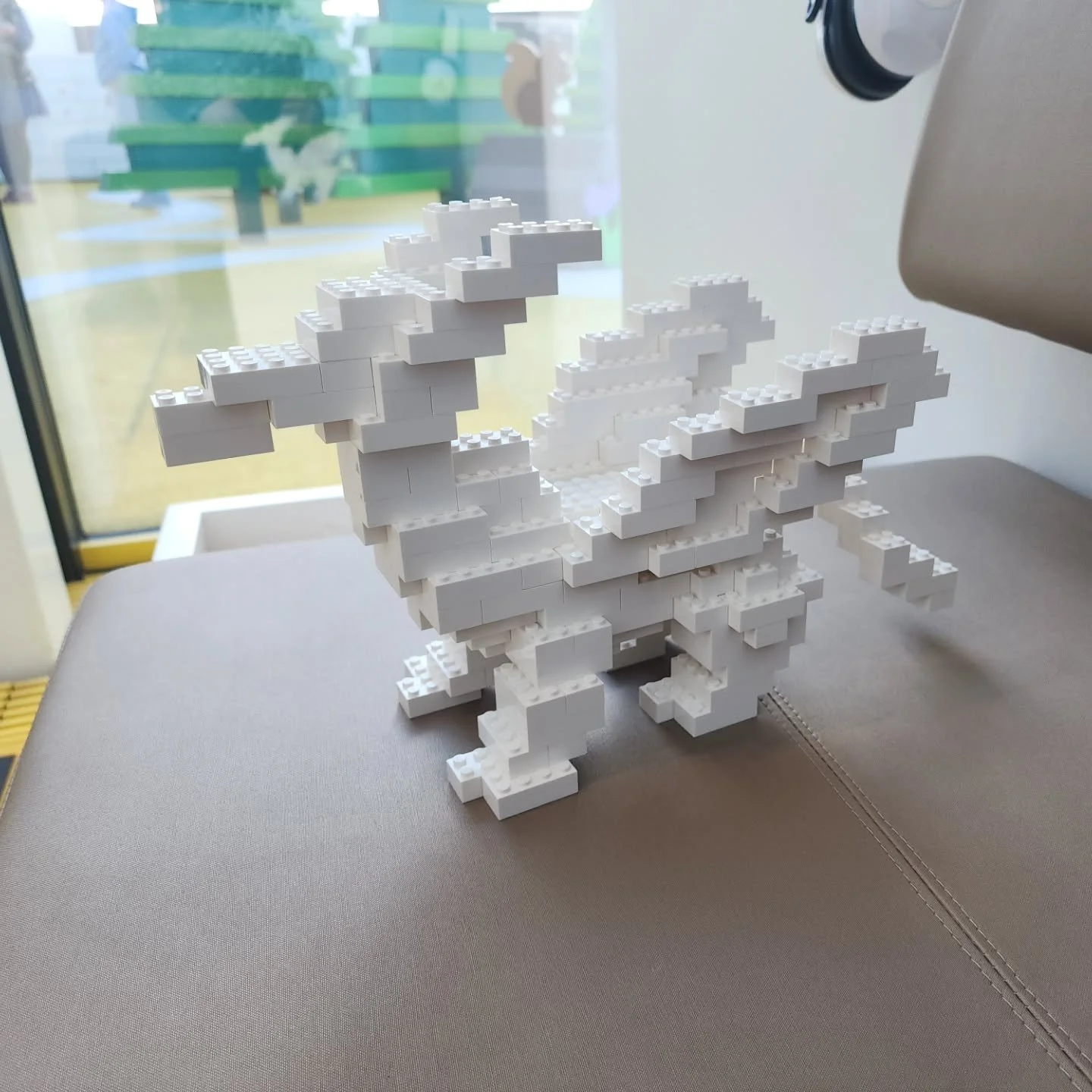 Lil' 2x4 gryphon-like thingy i built at the LEGO House. 

This was the first day of a trip with some friends (2nd slide!) and we all arrived at the House at different times. I had just crossed the Atlantic so I needed a respite from the weekend traff