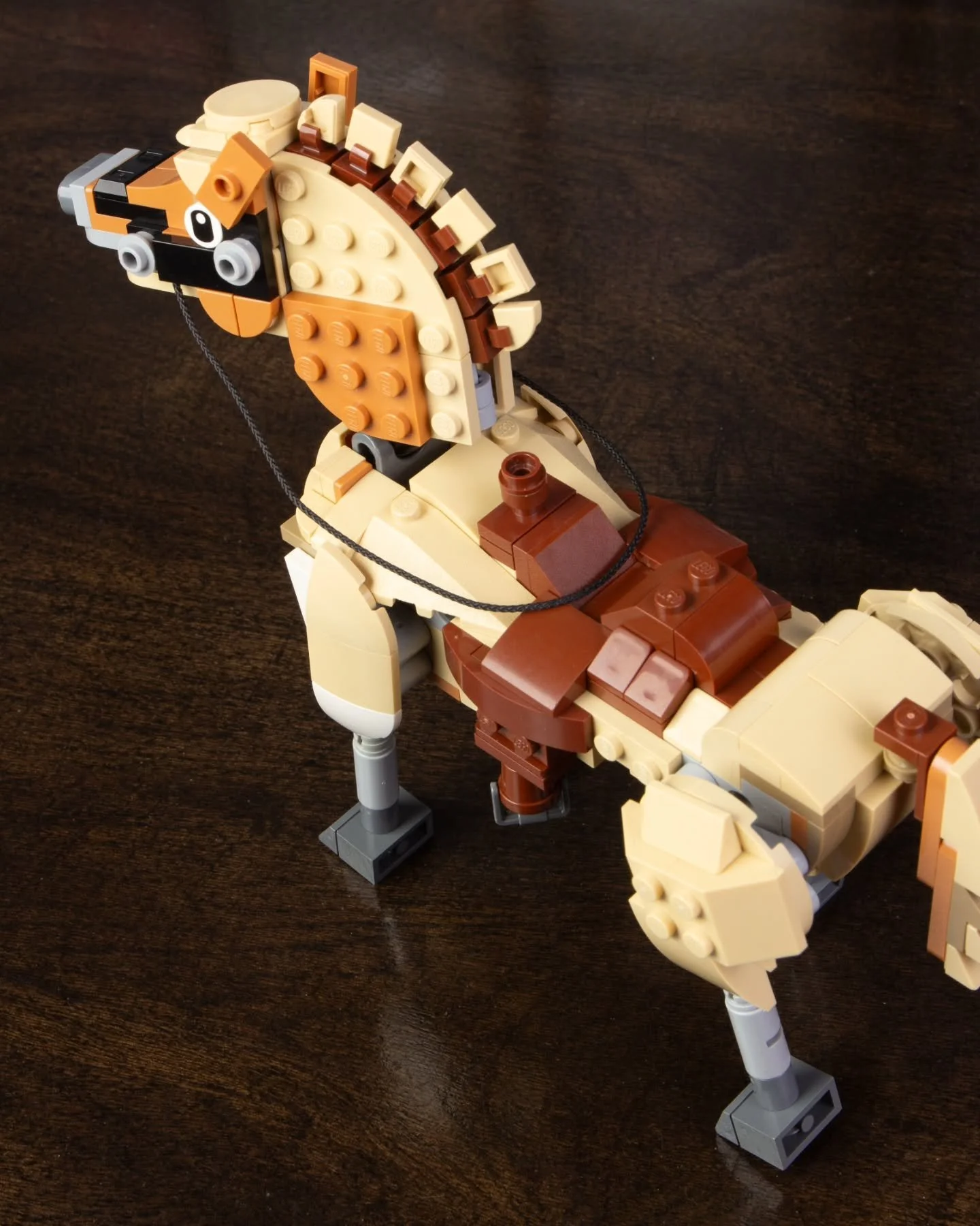 This horse build features working reins and a sculpted saddle. With more time for planning I'd aim for a smoother build like this year's Creator 3-in-1 Beautiful Horse, but getting the poseable neck and legs was more important for this vision.

#lego