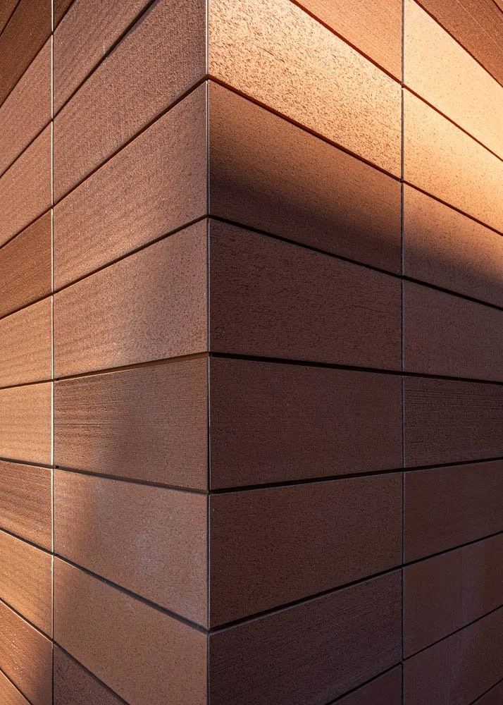 detail view of corner of building with terra cotta cladding