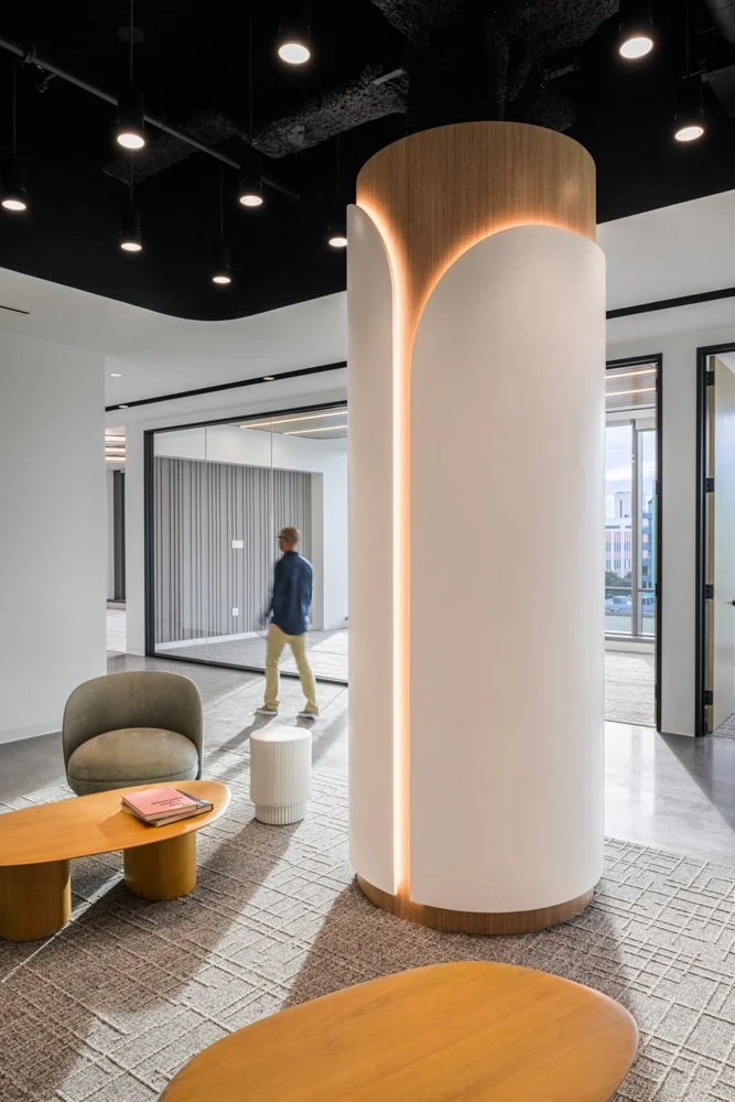 decorative custom column cover in a modern office, man walking by