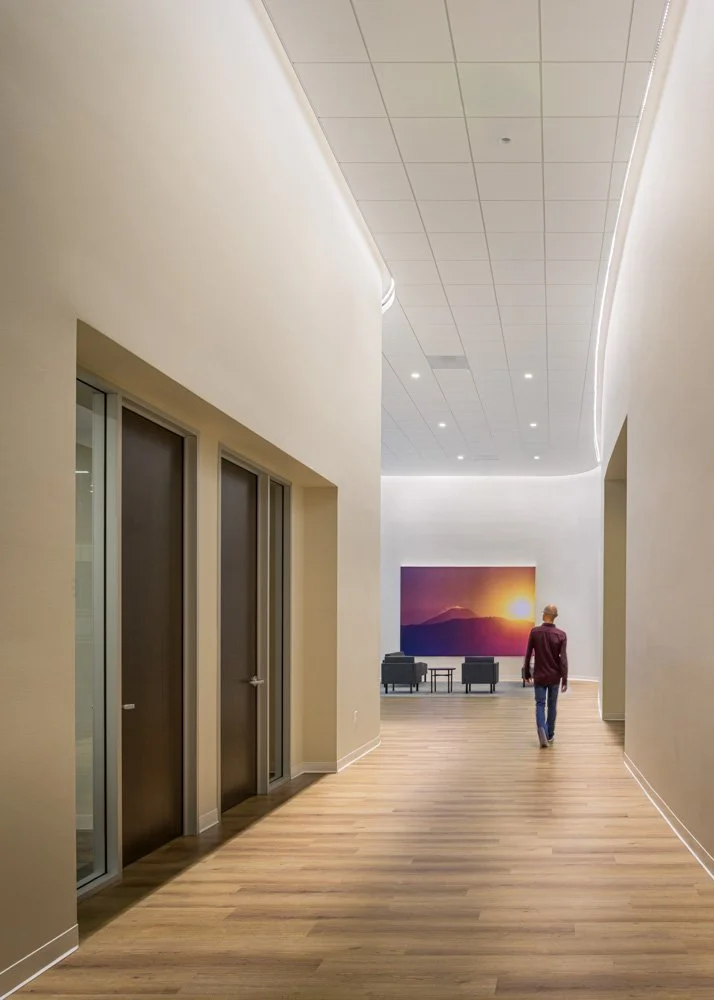 corridor with high ceilings and curved walls, man walking