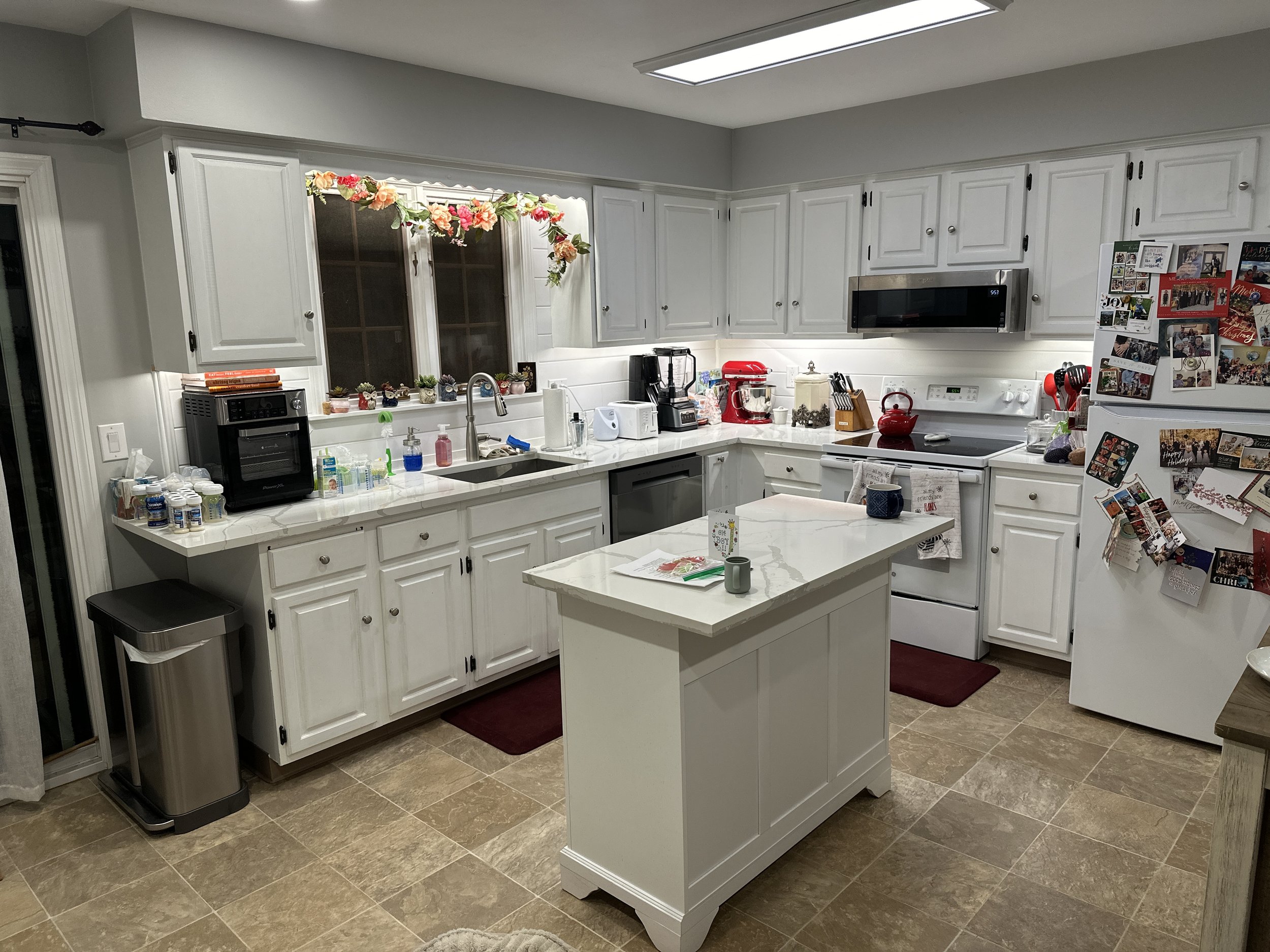 "Modern kitchen featuring custom recessed lighting and under-cabinet lighting installed by a licensed electrician.
