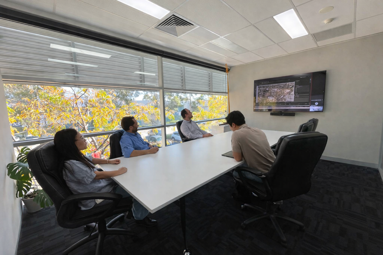 DEC Projects estimating team in the board room during a learning and development day. New skills including bluebeam, first principals estimating and more.