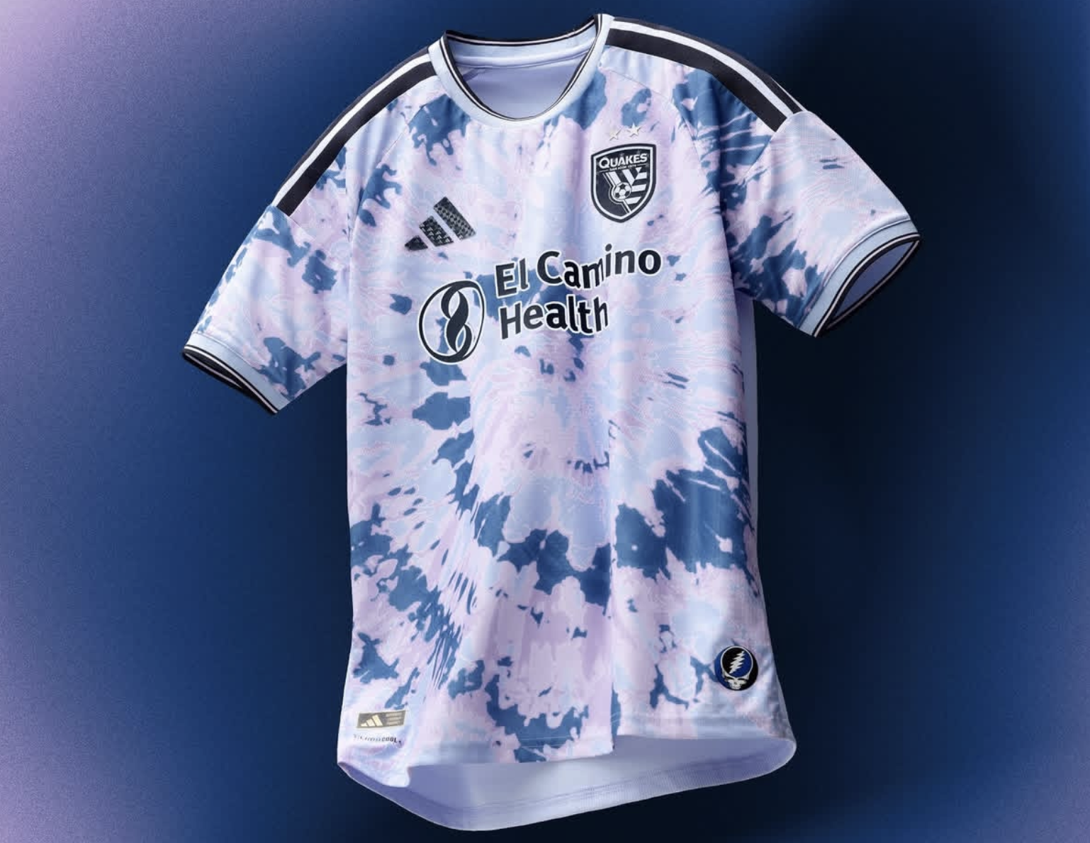 San Jose Earthquakes 2026 jersey - a light blue, dark blue, lavender tie-dye spiral with black & white stripes on the shoulders, a Grateful Dead logo on the lower left corner