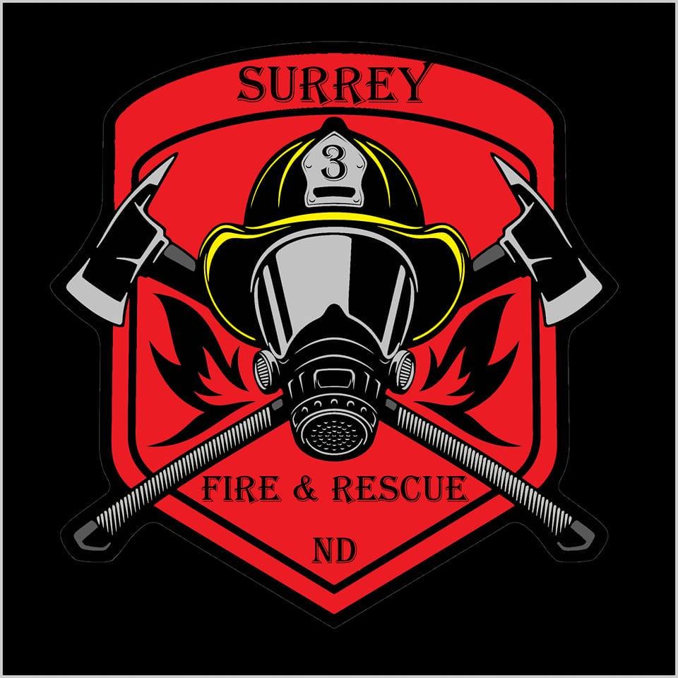 Firefighter emblem with a gas mask, fire axe, and axe, featuring the text 'Surrey Fire & Rescue ND' on a red and black background.