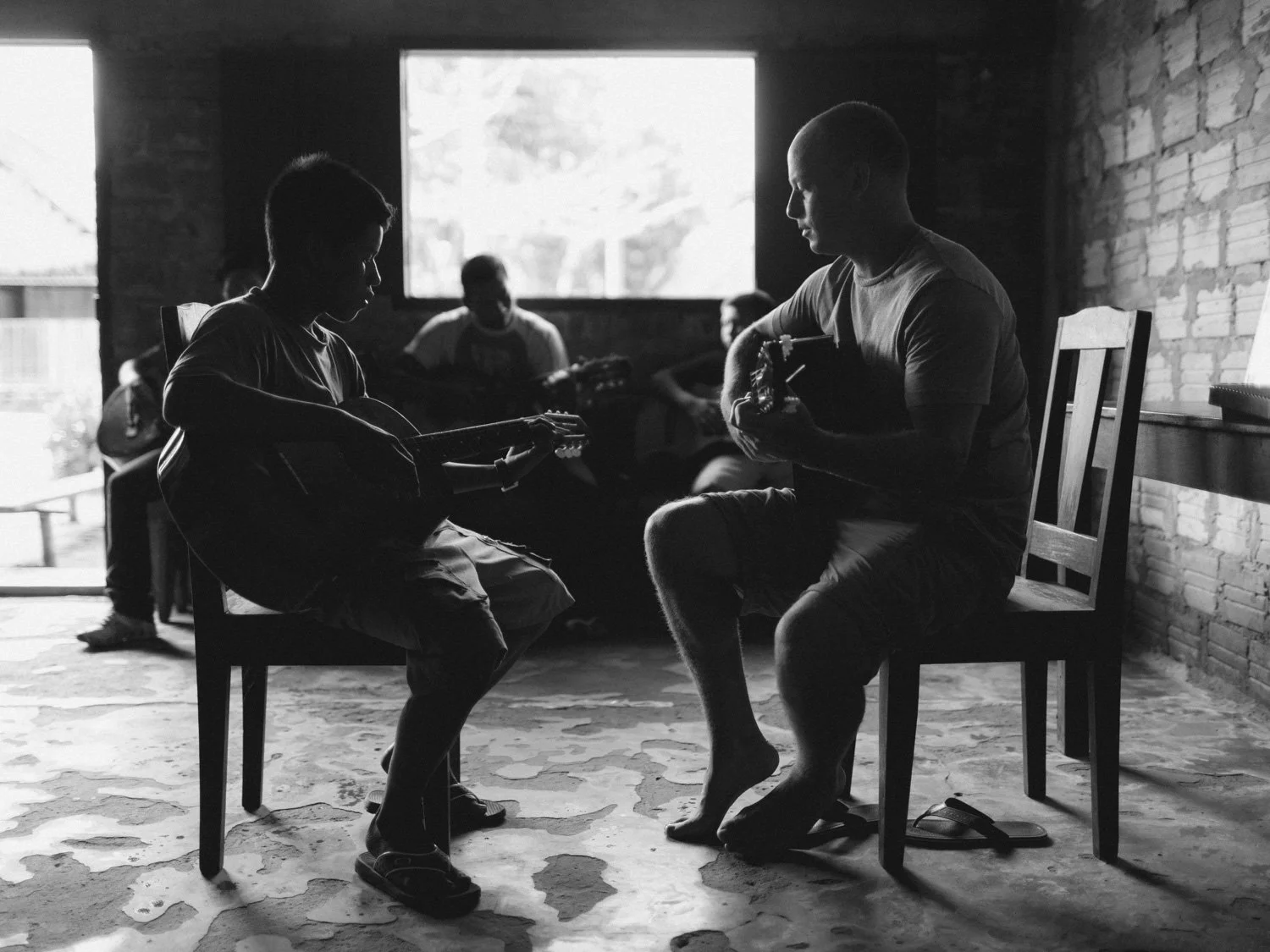 Nick teaching guitar lessons to a group in the Amazon.