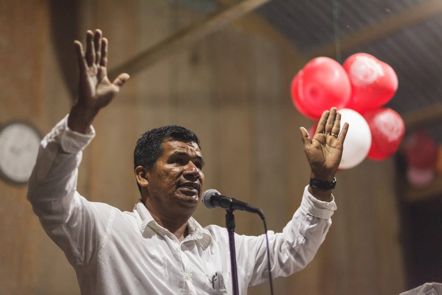 Pastor Jorge passionately preaches during a worship service in the Amazon.
